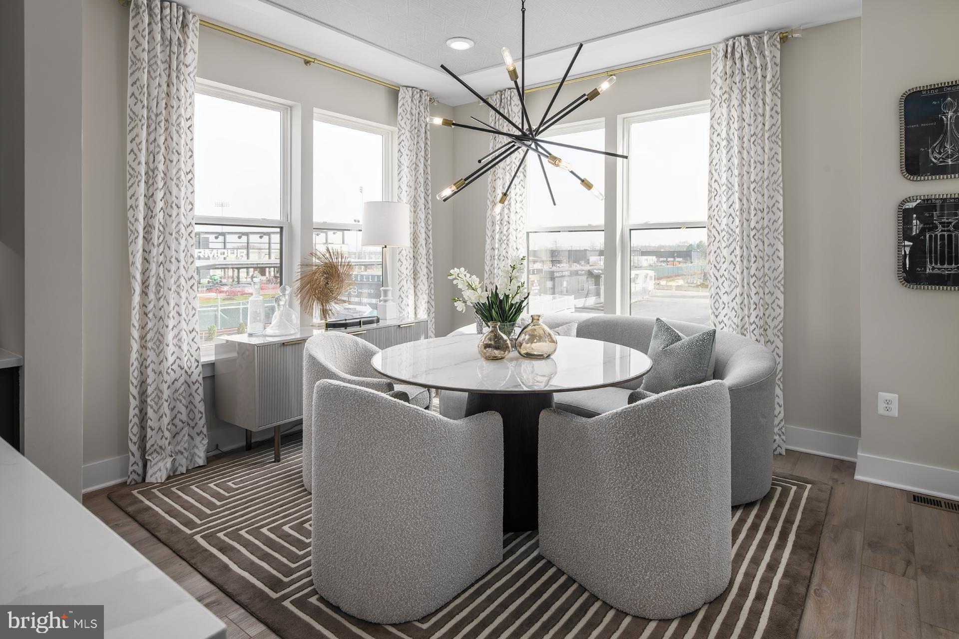 **OFFERING UP TO $72,500 IN FLEX CASH WITH USE OF BUILDERS APPROVED LENDER AND TITLE. Lower your price, cover your closing costs, or buy your rate down** 
Welcome to the Rockland, an open-concept luxury townhome with modern finishes and an urban aesthetic! Enter the home through the main entryway or the rear load 2-car garage, both leading into a spacious study with a full bathroom. Ascending to the second level, you will discover the main living space comprised of a sunlit family room, a generously sized premium chef kitchen, and a dining room complete with a sliding glass door and rear deck access. With an oversized island and premium Cafe appliances, this space is truly chef worthy. When it's time to relax, retreat to the primary suite, a private getaway that can be found on the third level of the townhome. Which includes a large walk-in closet and a spa-like bathroom that features dual vanity sinks and a seated Roman Shower. The laundry room is also located on the third level, conveniently accessible from the primary suite and secondary bedrooms. Enjoy stunning views from the fourth level's loft deck, a private outdoor living area perfect for entertaining. Flexible by design, the fourth level offers open 14 X 28 entertaining recreation space, and Wet Bar. ***THIS PROPERTY MAY QUALIFY FOR THE BROWNFIELD TAX CREDIT. WHICH COULD RESULT IN UP TO A 70% REDUCTION IN ANNUAL CITY PROPERTY TAXES FOR TEN YEARS***  See sales consultant for more information. *Photos may not be of actual home. Photos may be of similar home/floorplan if home is under construction or if this is a base price listing.