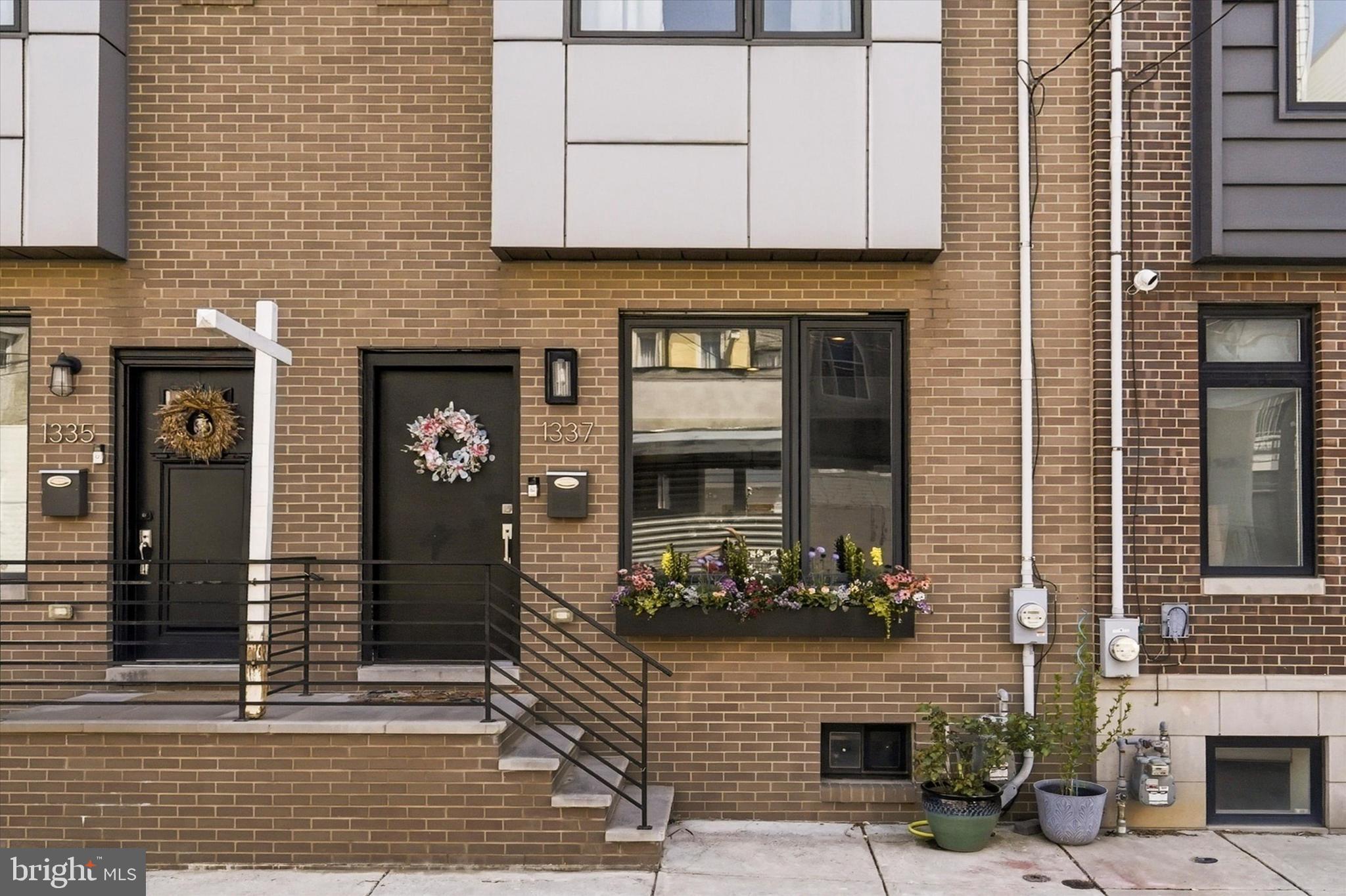 Welcome to 1337 S Opal Street, a stunning 16-foot-wide contemporary townhouse with 3+ years left on the tax abatement, nestled in the heart of Philadelphia’s vibrant Point Breeze neighborhood. Built in 2018, this 2,100-square-foot residence masterfully blends modern luxury with urban convenience. The home greets you with an expansive open-concept main floor, featuring rich hardwood flooring, high ceilings, and recessed lighting that flows seamlessly from the inviting living area into a gourmet eat-in kitchen. Equipped with sleek cabinetry, high-end stainless steel appliances, and quartz countertops with island seating, the kitchen is a chef’s dream—perfect for hosting intimate dinners or larger gatherings. Just beyond the kitchen, a private fenced rear patio offers a tranquil outdoor retreat for morning coffee or alfresco dining.

The upper levels are thoughtfully designed for privacy and comfort. The second floor hosts two spacious, light-filled bedrooms with generous closet space and a stylishly appointed full bathroom featuring designer tile work. The entire third floor is dedicated to a luxurious primary suite, a true urban sanctuary boasting a massive walk-through closet and a spa-like ensuite bathroom with dual vanities and premium finishes. Crowning the home is a spectacular private roof deck that provides breathtaking, unobstructed views of the Center City skyline—the ultimate backdrop for evening entertaining or watching the sunset.

Beyond the main living floors, the finished lower level adds versatile space for a media room, home gym, or office, and includes a convenient laundry area and additional storage. Situated on a quiet, charming street, this home places you just steps away from local favorites like the American Sardine Bar and Dock Street Brewery, with the shops and dining of Rittenhouse Square and Center City just a short commute away. With its sleek design and prime location, this property offers an exceptional opportunity to experience the best of Philadelphia living.