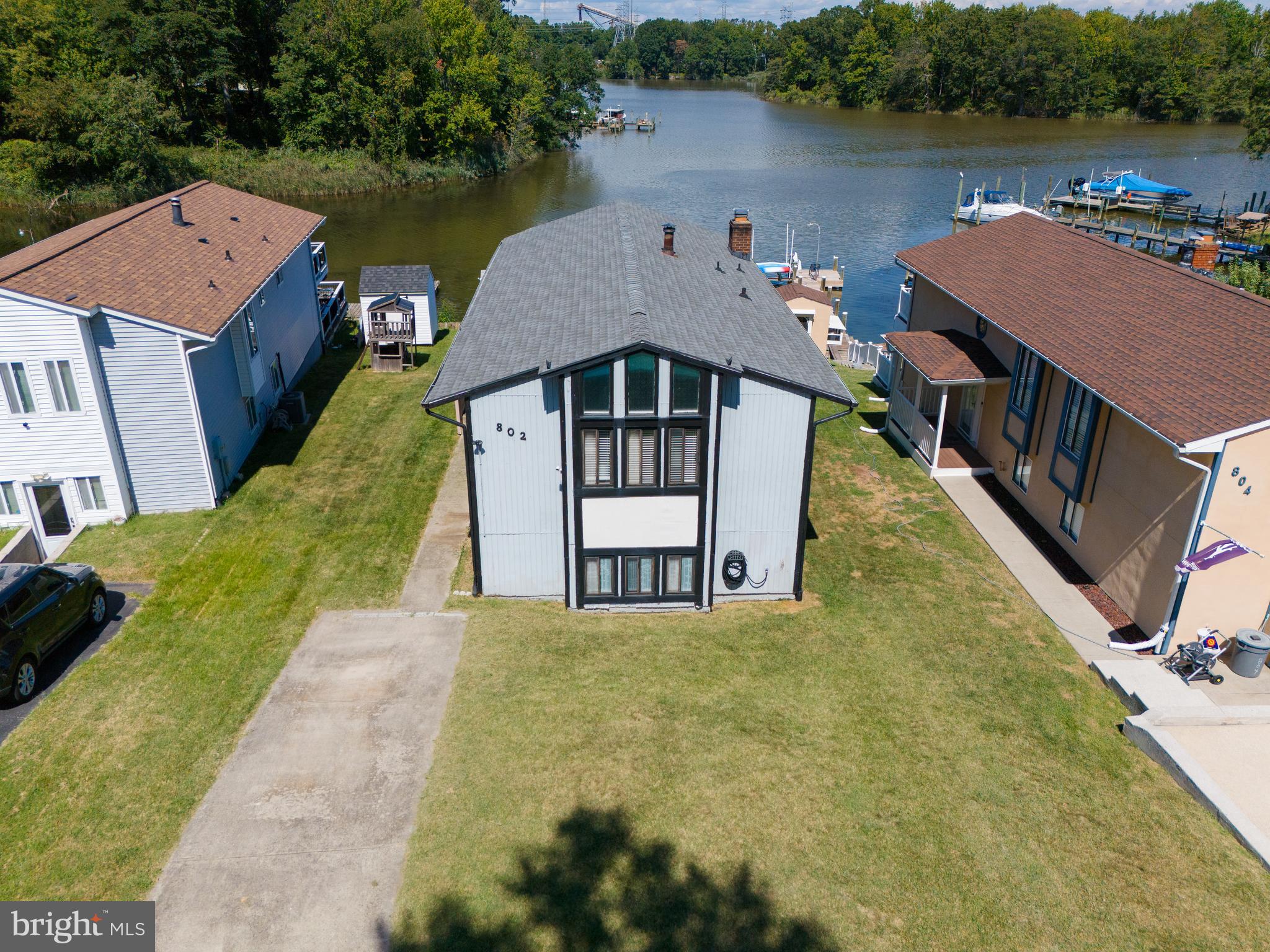 ✨ Waterfront Living Just in Time for Spring

As the days grow longer and the Chesapeake comes back to life, 802 Waterview Drive offers the kind of waterfront lifestyle people dream about all winter.

Tucked into a quiet cove along Cox Creek, this home blends privacy, natural beauty, and effortless coastal living. With expansive water views, a recently refreshed private pier, and multiple outdoor spaces designed to embrace the shoreline, every day here feels like an invitation to step outside and enjoy the water.

Imagine starting your mornings with coffee on the deck as the sun rises over the cove. Herons glide across the glassy water, boats ease out for the day, and the pace of life naturally slows down. By afternoon, the pier becomes the center of activity — launch a kayak, paddleboard along the shoreline, or take the boat out for an afternoon on the Chesapeake. With space for two boat slips plus room for jet skis and water toys, the water is always just steps away.

As evening settles in, the setting shifts again. The sky turns golden, reflections dance across the cove, and sunsets become part of your nightly routine.

Inside, the home is designed to capture these views at every opportunity. The vaulted great room welcomes you with soaring ceilings, a warm wood accent wall, and expansive sliding glass doors that frame the water beyond. Natural light pours into the space, creating an open, relaxed atmosphere perfect for everyday living or hosting friends after a day on the water.

The dining area flows seamlessly to the waterfront deck, making indoor-outdoor entertaining effortless. The updated kitchen features quartz countertops, custom cabinetry, and stainless steel appliances — a beautiful and functional space for preparing everything from casual breakfasts to seafood dinners fresh from the bay.

Three comfortable bedrooms and a spa-inspired full bath complete the main level, offering peaceful retreats at the end of the day.

The walkout lower level expands the living space with a spacious family room featuring a fireplace and slate tile flooring, ideal for cozy evenings or relaxed gatherings. A guest bedroom, second full bath, laundry area, and additional storage provide flexibility for visitors, extended family, or multi-generational living.

Practical features complement the home’s natural beauty, including a generous parking pad, public water and sewer, and the freedom of no HOA. Residents also enjoy access to a nearby community beach and tot lot, while Routes 695, 295, and 100 provide convenient access to the entire region.

Recent improvements include a new roof (2022), renovated kitchen with new appliances (2022), updated bathrooms (2021 & 2023), new flooring throughout (2023), fresh interior paint, new hot water heater (2023), new sump pump (2023), and a refreshed dock and pier with new boards and stain (2022).

🌅 At 802 Waterview Drive, the water isn’t just the view — it becomes part of how you live every single day.