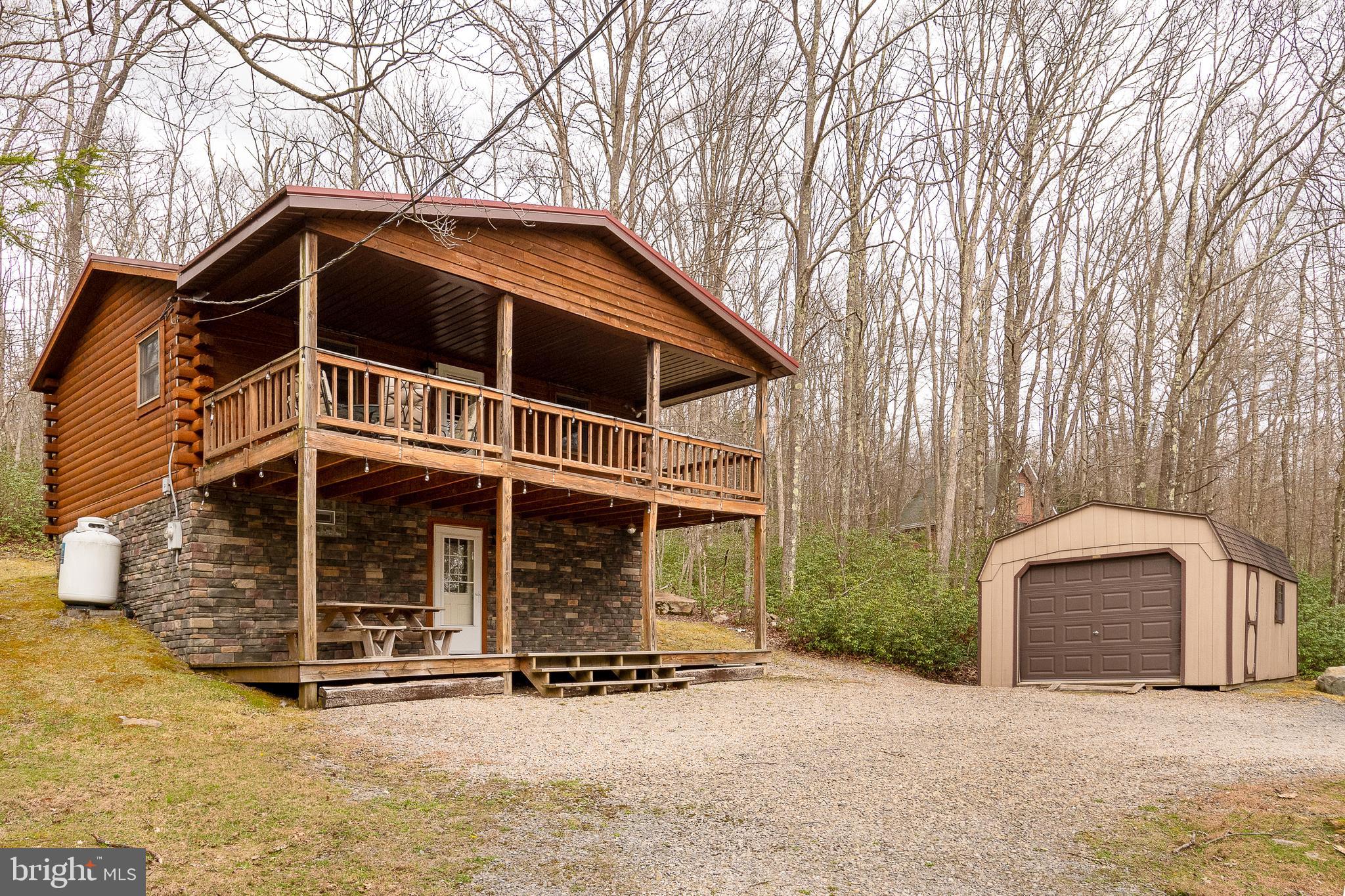 Tucked away in the scenic beauty of Yough Mountain Resort, this exceptional 2-bedroom, 2-bath log cabin offers the perfect blend of rustic charm and modern comfort. Spanning two stories, this immaculately maintained home has seen thoughtful renovations in recent years, creating a warm and inviting retreat that’s move-in ready.

Step inside to discover cozy living spaces ideal for relaxing after a day in nature, with classic log cabin character throughout. Whether you're looking for a peaceful weekend escape or a year-round getaway, this home delivers comfort, privacy, and timeless appeal.

Surrounded by the natural beauty of Garrett County, Yough Mountain Resort is known for its expansive scenic views and outdoor lifestyle. Enjoy direct access to miles of trails perfect for hiking, biking, and ATV adventures—right from your doorstep.

If you’ve been dreaming of a private mountain retreat where you can unwind, explore, and recharge, this beautifully updated cabin is your opportunity to own a piece of Western Maryland paradise.