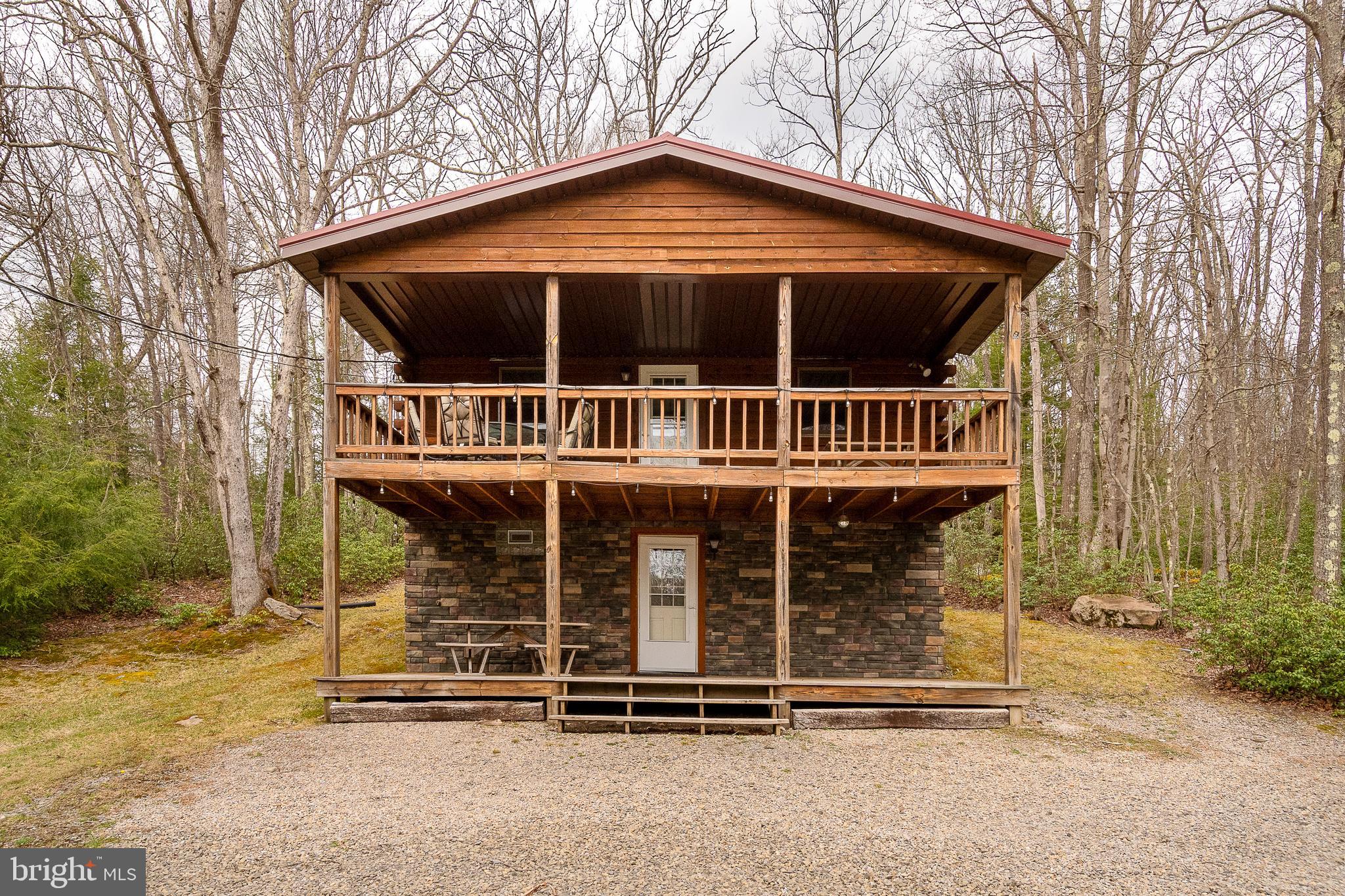 Tucked away in the scenic beauty of Yough Mountain Resort, this exceptional 2-bedroom, 2-bath log cabin offers the perfect blend of rustic charm and modern comfort. Spanning two stories, this immaculately maintained home has seen thoughtful renovations in recent years, creating a warm and inviting retreat that’s move-in ready.

Step inside to discover cozy living spaces ideal for relaxing after a day in nature, with classic log cabin character throughout. Whether you're looking for a peaceful weekend escape or a year-round getaway, this home delivers comfort, privacy, and timeless appeal.

Surrounded by the natural beauty of Garrett County, Yough Mountain Resort is known for its expansive scenic views and outdoor lifestyle. Enjoy direct access to miles of trails perfect for hiking, biking, and ATV adventures—right from your doorstep.

If you’ve been dreaming of a private mountain retreat where you can unwind, explore, and recharge, this beautifully updated cabin is your opportunity to own a piece of Western Maryland paradise.