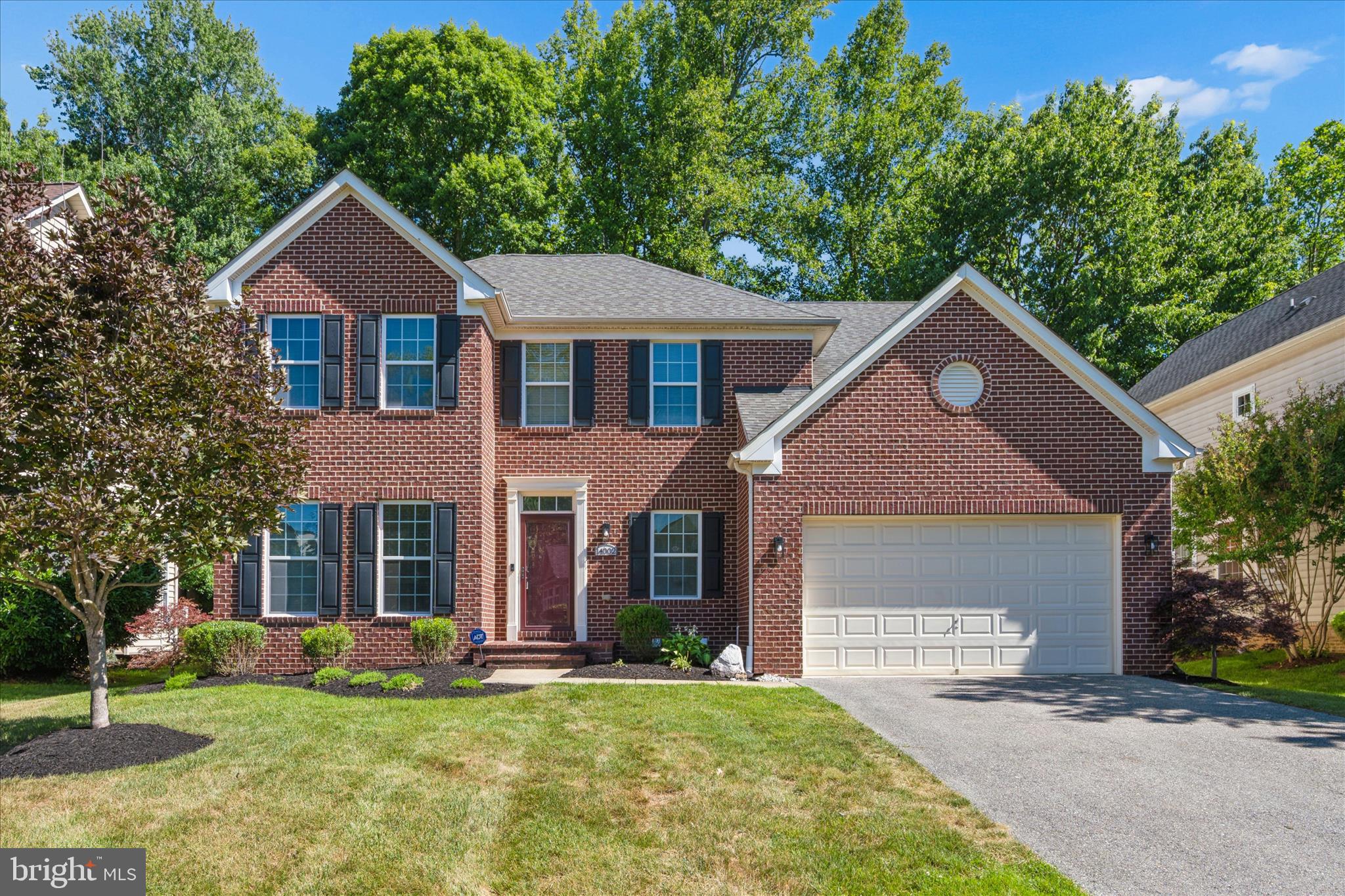 Welcome to Oak Creek Club, Upper Marlboro's premier gated community, where luxury living meets exceptional amenities. This stunning 4-bedroom, 3.5-bath Colonial offers more than 4,100 square feet of beautifully finished living space across three levels and is perfectly situated on a premium lot backing to mature trees and the 7th fairway of the golf course, providing both privacy and picturesque views. Freshly painted throughout and refreshed top to bottom, this move-in-ready home impresses from the moment you enter the grand two-story foyer. The open and inviting floor plan is designed for both everyday living and entertaining. A formal living room to welcome guests or the perfect office, while the spacious family room showcases a striking stone fireplace and flows seamlessly into the kitchen, creating the perfect gathering space. The gourmet kitchen is tying the flow all together with beautiful timeless wood cabinets,  gorgeous quartz countertops and stainless steel appliances. The bright morning room offers an ideal setting for casual meals while overlooking the backyard, and the formal dining room provides an elegant space for hosting special occasions. Upstairs, the luxurious owner's suite features a tray ceiling, two walk-in closets, a jetted soaking tub, and a separate shower for a true retreat experience. The remaining secondary bedrooms are very large and spacious for everyone to spreadout. The fully finished lower level is very versatile and expands your living options with a large recreation room, media room or 5th bedroom if you desire, exercise room and full bath. Outside, enjoy relaxing or entertaining on the expansive brick patio surrounded by beautiful trees. An outdoor irrigation system helps keep the lawn and grounds looking their best all season long. Residents of Oak Creek Club enjoy outstanding community amenities, including a swimming pool, tennis courts, fitness center, walking and fitness trails, and an on-site golf course. This exceptional home combines space, comfort, updates, and an unbeatable location in one of the area's most sought-after communities.