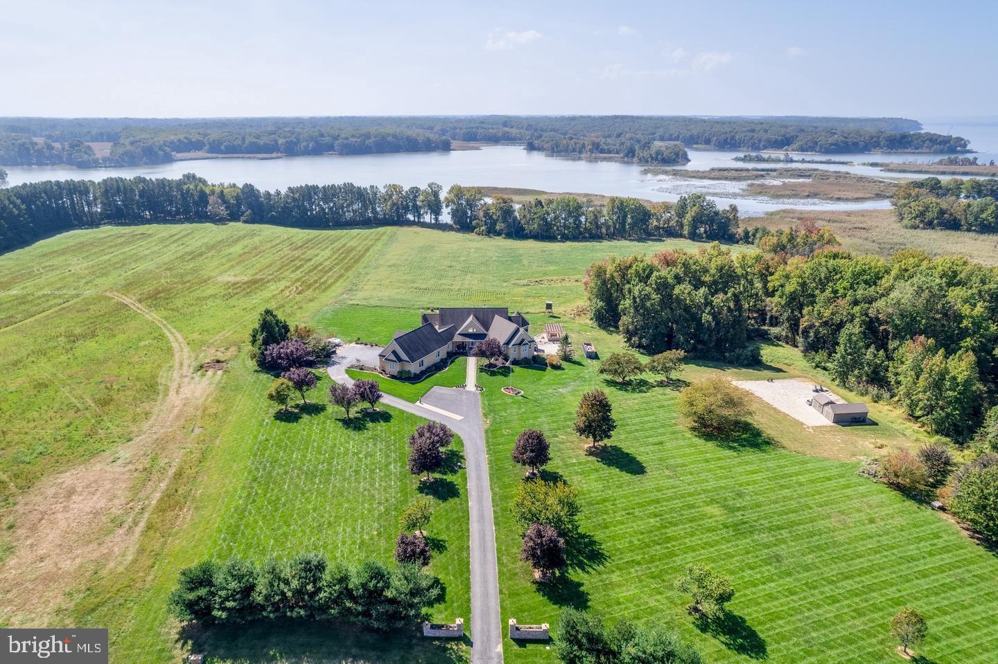 Welcome to where dreams come true in an exclusive Waterfront neighborhood located in Sunset Pointe, Earleville MD....This stunning 2 story Sprawling Ranch is on 19.32 acres of breathtaking views of fields, wildlife and the open waters of Pond Creek.  This meticulously renovated property featuring a beautifully redesigned family room with a wood-burning fireplace that has been tiled from floor to ceiling with custom tile, also featuring electric blinds just added to the specular windows that take all the views in....  The kitchen boasts new Bosch appliances, granite counter tops, wine refrigerator, counters galore, sub zero refrigerator, new above lighting cabinets, instant hot water at the sink, new sink and so much space...  The Large dining area leads to an expanded deck with composite flooring and stone pillars. The office/sunroom which is located off the kitchen area has beautiful full glass etched french doors fireplace that compliments the family rooms...The solid door off this room that has a designer staircase down to the lower level patio ....As you walk through the kitchen there is a half bath that is located next to the large mudroom with another door that exists to another new deck expanded  also with composite floors and an overhang.....This mudroom has space for everyone .... separate locker area and a dogs haven with a doggie water bowl filler....Now lets head back to the other side of the family room ....Welcome to the primary suite that has it's own gazebo deck private to you with sliding glass doors that also exit from this suite....This newly renovated primary bathroom has heated floors, custom cabinets, large Jacuzzi tub including an oil diffuser and automatic dryer ....marble shelve with a TV .... the shower will WOW you with a shaving station with it's own faucet and mirror....and custom tiling like no other.... The laundry room is outside of the the primary bedroom with all custom closets and is conveniently within access of the other first floor bedrooms .....Bedroom 2 and 3 on the first floor have custom closets and share a jack and jill bathroom with stunning updates....also another Jacuzzi and walk-in shower. Now lets head back to the foyer and down to the lower level .....First you are greeted with a large game room that has beautiful sliding doors out to the new salt water pool ....This lower level has 2 full bathrooms one that is handicap-accessible and connects to a beautiful 4th bedroom with it's own set of sliding glass doors leading out to a lovely patio....Wait!!! there is more.... a theater room features great a 100 inch screen, movie lights, platform seating with counter top seating to eat your popcorn... decorated with great design and to top it off a kitchenette completes this impressive space..... Are you ready to step outside and see this impressive yard.....again the New salt water pool, the dyed concrete decking around the pool, the hardscaping, landscaping, and a wood trellis with planting features..... Additional highlights include a full house generator, invisible dog fence, and outdoor lighting. This property is a truly a one-of-a-kind gem!   Just in case that was not enough to impress here are 2 more features....The large 3 car garage has new door openers, and above it is an efficiency apartment has been fully renovated with high ceilings and  small kitchenette, new small deck, new large full bathroom ...did I mention this studio has wood walls that are from ........This is also a hunters enclosed 2 person deer blind, great fishing and crabbing a great outdoors persons dream.....10 acres are currently being farmed agriculturally..