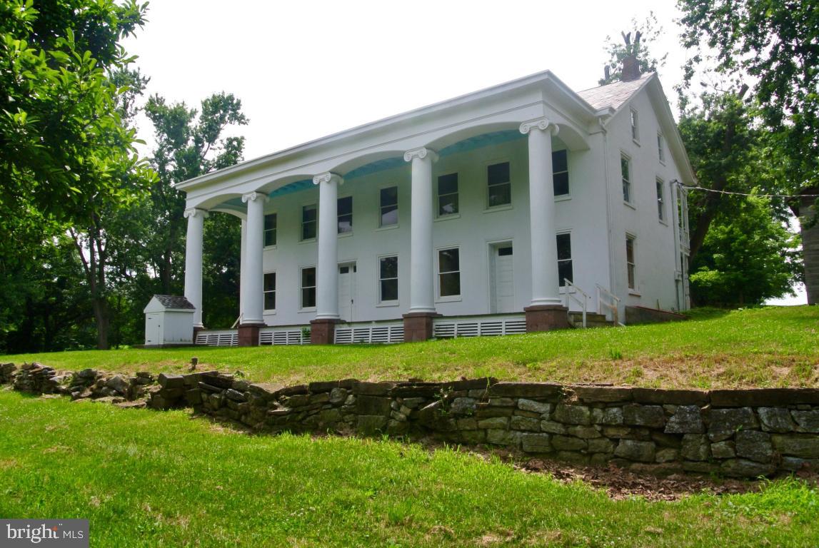 Tons of opportunities here...Original Donegal Mill on property with huge Georgian Style Home, plus several additional buildings and barns/Being sold ''as-is'' (needs TLC) on 55 +/- acres perfect for outdoor enthusiasts/ Great for hunting, fishing, or just soaking up the outdoors.  (Could possibly be special event venue for the ambitious buyer).
