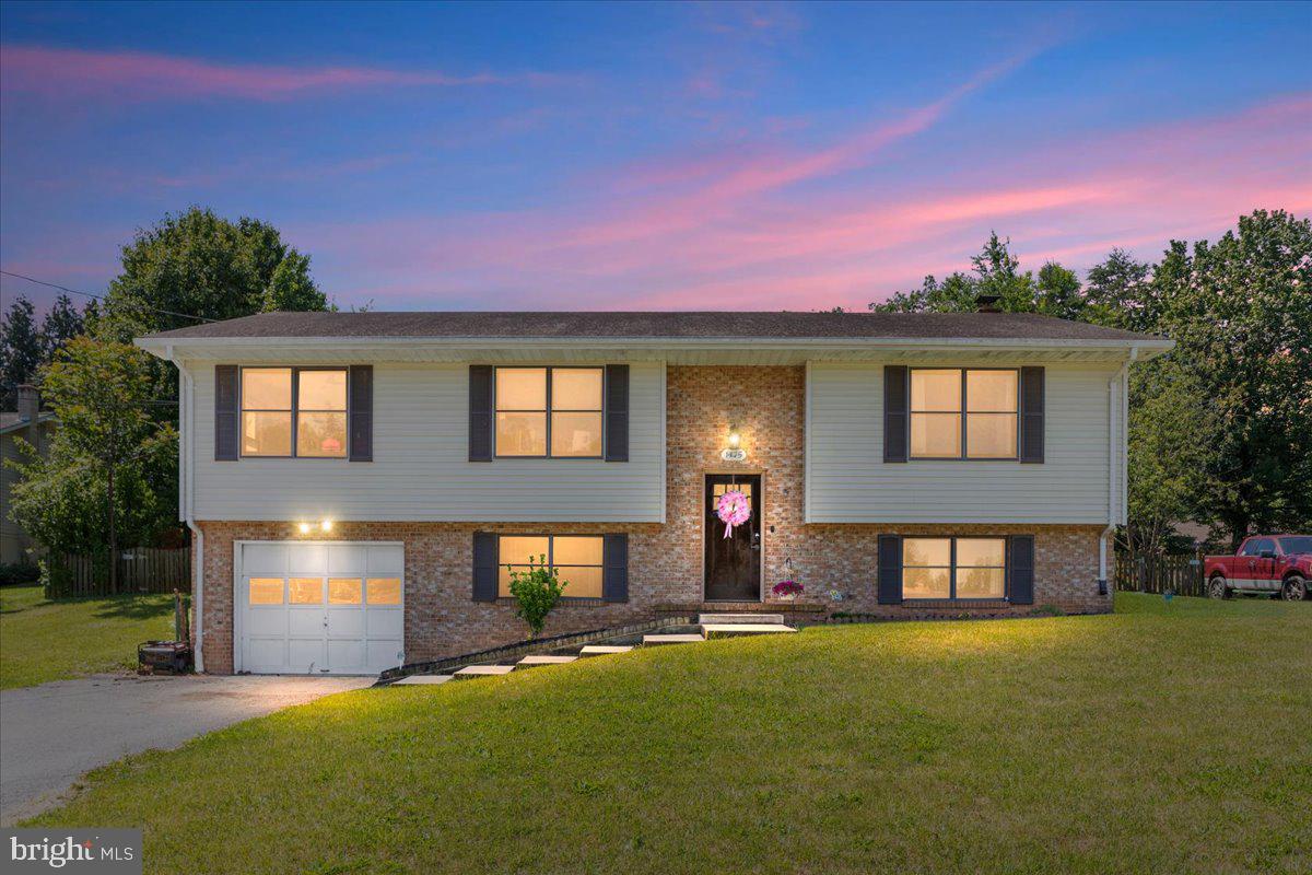 With mountain views, a generous 1/3-acre lot, and a convenient location just minutes from downtown Front Royal, this well-loved brick and vinyl split foyer offers the perfect blend of space, scenery, and accessibility. Enjoy easy access to schools, shopping, restaurants, wineries, breweries, and major commuter routes including I-66, I-81, and Route 55. Outdoor enthusiasts will love being close to the Shenandoah River, Skyline Drive, and Shenandoah National Park.

The main level features a comfortable family room, dining area, kitchen, three bedrooms, and two full baths. The kitchen is accented with Corian countertops and a custom backsplash. The fully finished lower level provides additional living space with a large recreation room, third full bath, laundry area, and a versatile bonus room ideal for a home office, den, hobby room, gym, or guest space. An attached garage offers added convenience and storage.

Step outside to the fully fenced backyard, complete with mature peach, pear, and apple trees and plenty of room to relax, entertain, garden, or play.

Priced with HVAC replacement, repairs and cosmetic improvements in mind, this home presents a fantastic opportunity to build quick and impressive equity in sought-after Front Royal. Sold strictly AS-IS and available for a quick closing, this property offers space, flexibility, and long-term value for buyers ready to make it their own.