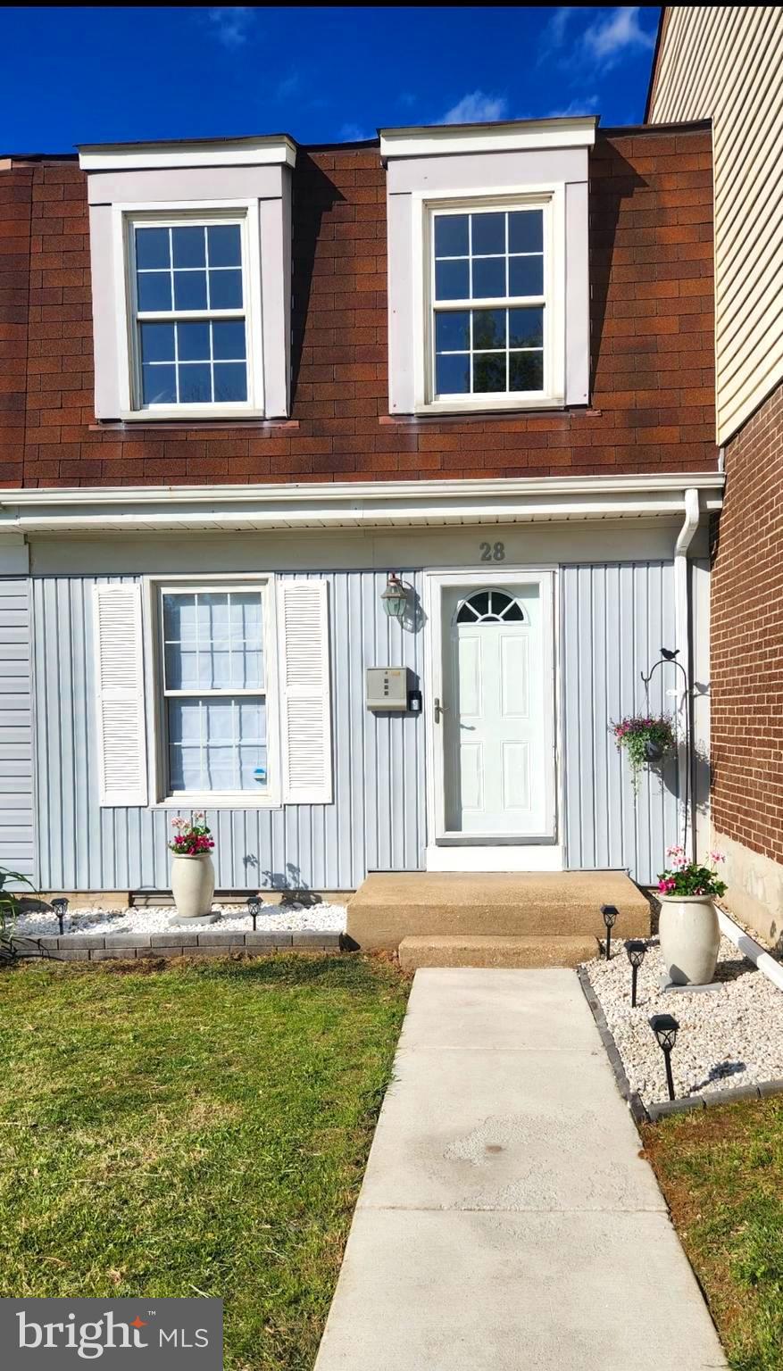 Welcome to 28 Melken Court, where comfort, quality, and convenience come together in a beautifully maintained townhome nestled on a premium lot backing to scenic walking trails and mature trees. Enjoy the perfect balance of peaceful living in a quiet court setting while remaining just minutes from major highways, shopping, dining, and commuter routes.  Pride of ownership is evident throughout this meticulously cared-for home. Recent updates include fresh paint and new carpeting throughout (2026), replacement closet doors with updated hardware (2026), enhanced front landscaping, an upgraded electrical panel with whole-house surge protection (2019), Leaf Filter gutter guards with transferable lifetime warranty, HVAC system (2022) with transferable warranty, and a gas water heater (2022) with transferable warranty + tilt-out windows provide easy cleaning maintenance.  The renovated kitchen is both stylish and functional, featuring stainless steel appliances, a full size refrigerator (2022), under-cabinet lighting, a breakfast nook with abundant storage, and a trendy subway tile backsplash, with additional access to yard for those great BBQs to come!   The separate dining area offers even more options for entertaining at it's best.  Upstairs, you'll find 3 BRs, all enhanced with neutral new carpeting and updated closet doors, providing the utmost in comfort. The spacious Primary offers generous closet space & unhindered sunlight, while the recently renovated full bath features a modern soaking tub, elegant marble niche & tile, decorative vanity with updated lighting, creating a spa-like retreat. The finished lower level expands your living space with new carpeting and recessed lighting, making it ideal for a family room, home office, fitness area, or recreation space. The unfinished utility area includes updated washer and dryer units, great storage options and convenient access to the rear yard.  Step outside and discover your own private outdoor oasis. Backing to mature trees and walking trails, the backyard offers a tranquil setting for relaxing, entertaining, or simply enjoying nature. Residents also enjoy access to a community pool, making summer days even more enjoyable.  Move-in ready and thoughtfully updated from top to bottom, this exceptional home offers a rare opportunity to enjoy low-maintenance living in one of Nottingham's most desirable communities. Simply unpack and start enjoying everything this fantastic home has to offer!