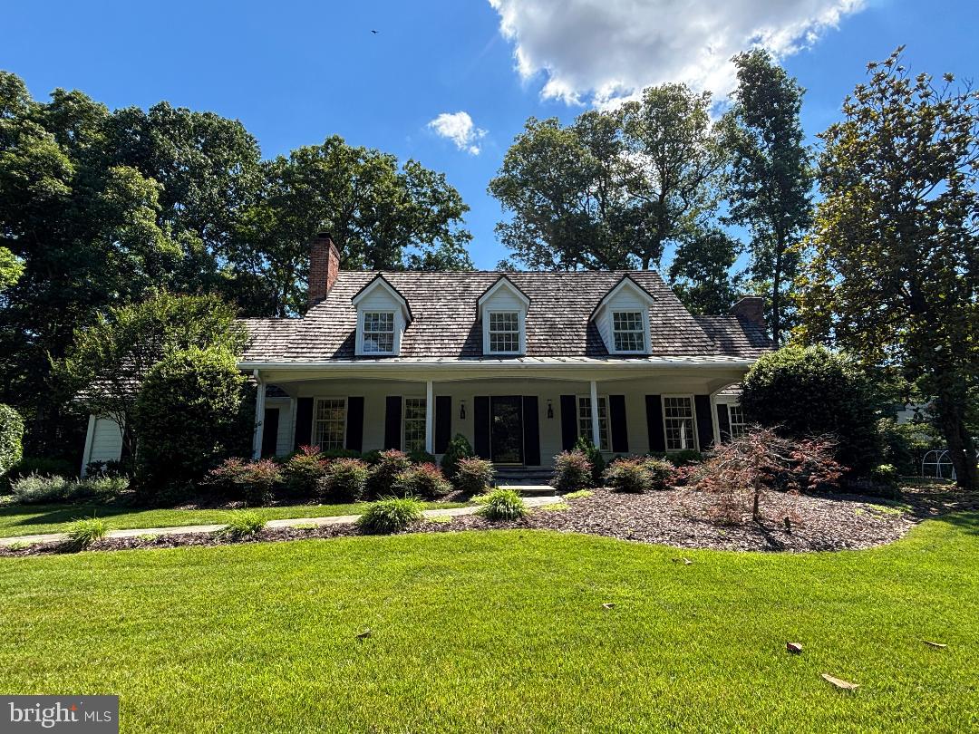 Beautiful, well‑maintained Cape Cod featuring an inviting covered front porch, cedar shake roof, Hardiplank siding, and a side‑loading garage, perfectly sited on a quiet court just minutes to Tysons and I‑495. The gorgeous almost one-acre private, treed lot offers slate walkways, beautiful  landscaped grounds, an irrigation system, whole‑house generator, and a storage shed.

Inside, enjoy a remodeled kitchen, updated tile bathrooms, and hardwood floors on two levels. Three wood‑burning fireplaces add warmth and charm throughout. The opulent primary suite includes his‑and‑hers walk‑in closets and a spacious private sitting room. Two additional bedrooms feature ensuite bathrooms.

Generous living and dining rooms complement the cozy family room that opens to the slate patio. The finished walk‑up lower level includes a recreation room, bonus room, fully equipped wet bar, and a large storage/utility room.

Located in the sought‑after Langley High School Pyramid. Optional membership available at nearby Woodside Lake.