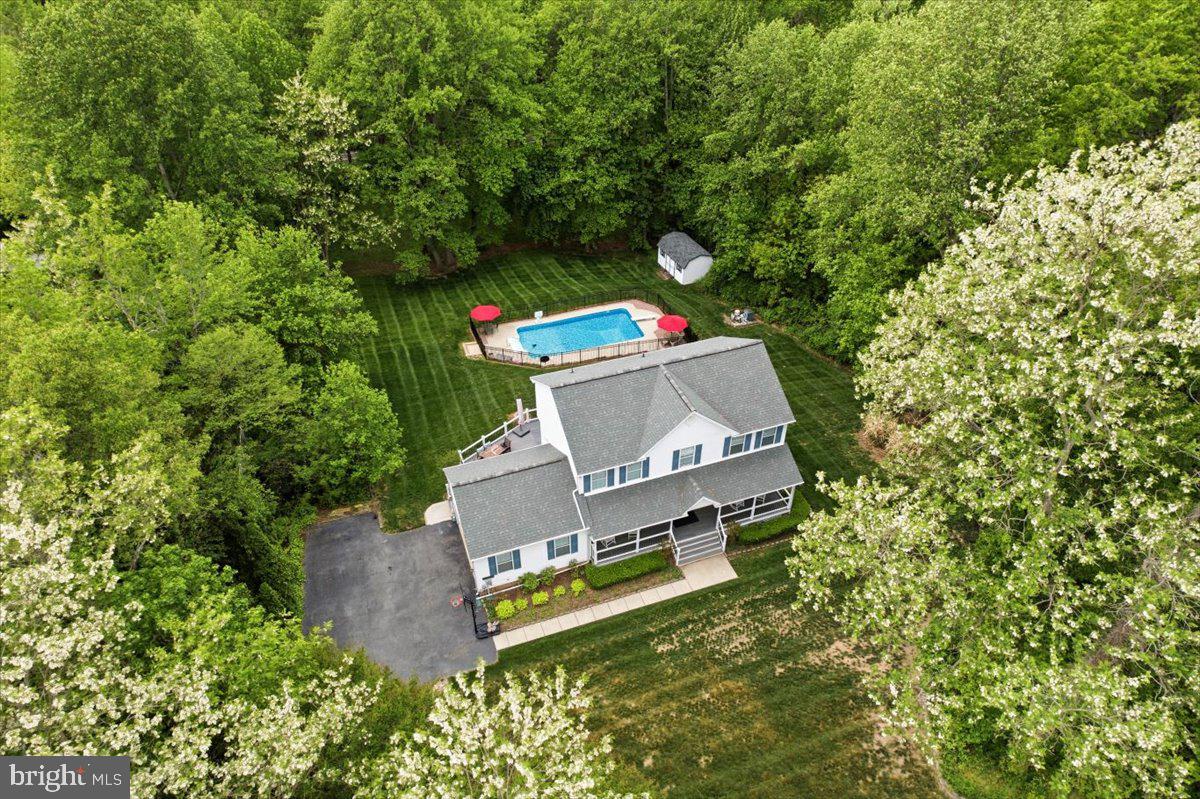 Calvert County colonial charmer - Huntingtown beauty! 🧡 A precious PEACH BLOSSOM FARM Neighborhood gem 🍑 this 4 BEDROOM, 2.5 BATH home, with IN-GROUND POOL and extensive recent upgrades, is located in the heart of Calvert County & within the TOP RANKING Huntingtown School District. 

Welcome to 3531 Fortuna Court. This 2 story colonial sits on a spacious homesite and offers a classic layout, outdoor living space and neighborhood amenities that make Peach Blossom Farm  one of Huntingtown’s most coveted communities. A welcoming wraparound front porch and long private driveway create inviting curb appeal from the moment you arrive. 

Inside you will find beautiful hardwood flooring, crown molding, chair rail detail and abundant natural light throughout the first floor. The traditional center hall floor plan includes a spacious dining room and comfortable living room while the kitchen opens to the family room creating the perfect space for everyday living and entertaining. Powder room, main level laundry and access to the 2-car side load attached garage, are all located on the first floor for ultimate convenience. The upper level features FOUR spacious bedrooms, providing the ideal layout for family living, guests, or home office space. The owner’s suite offers comfortable space, generous closet storage, and a private en-suite bathroom .

Out back you will find the perfect space for relaxation and entertainment. A large rear deck (2022) overlooks the backyard and leads to the private IN-GROUND POOL creating a true backyard retreat for summer  enjoyment. Recent pool improvements include new liner (2022), pool fence (2022), pool cover (2022), and updated pool filter equipment (2023). A detached storage shed provides additional storage for tools and equipment. This home also offers extensive recent upgrades including a NEW ROOF (2022), HVAC system replacement (2021), whole-house water filtration system (2021), garage door (2021), and garage door opener (2025). 

📍 LOCATION, LOCATION, LOCATION! 3531 Fortuna Court is located within the coveted PEACH BLOSSOM FARM community. Community amenities include two playgrounds, picnic pavilion, baseball fields, basketball  courts, and tennis courts. 3531 Fortuna Court is located within the top-ranking Huntingtown school district  and within a few minutes drive to the elementary, middle and high schools, as well as major commuter routes 2/4. Do not miss this rare opportunity to own a well-cared-for home with space, outdoor amenities, and a sought-after neighborhood location in Huntingtown! Schedule your showing today. 🍑