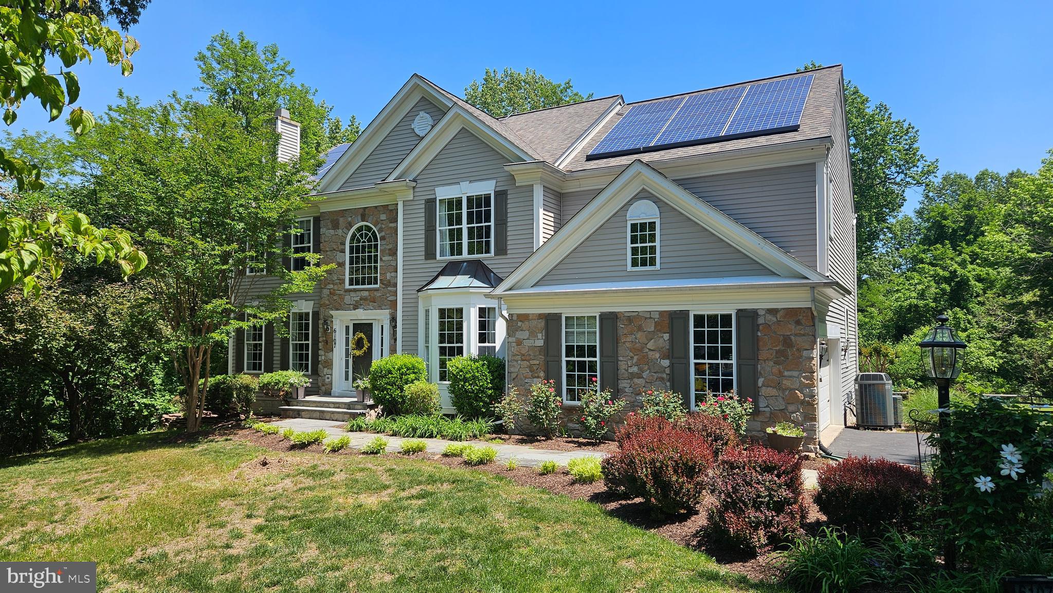 This is the home you've been dreaming of!  5 bedrooms, 4.5 baths, 2 fireplaces, sun room bump-out, a full, finished basement, 2 car garage, inground pool with that resort feel, 1.5+ acre lot, all in a neighborhood that connects to a gorgeous marina along the shores of the Chesapeake Bay.  The house features expansive gathering areas like the open, large kitchen, which flows into the sunroom and 2-story family room.  The primary suite is an oasis with tray ceilings, large windows with beautiful views of your pool and property, and additional space for lounging or exercising.  The ensuite bath is very large and is bound to make you emerge refreshed and ready to face your day.  The second bedroom is large and offers its own bath and walk-in closet.  The third and fourth upstairs bedrooms offer a Jack and Jill bath, generous sizes, and plentiful natural light.  The lower level is finished and ready for fun!  Home theater, kitchenette/bar area with an island, pool table space, an additional fifth bedroom, another full bath, and a huge storage area.  Step out the back door and experience the gorgeous pool and patio areas.  Follow the neighborhood trail to Herrington Harbour North Marina, where you can pay to dock your boat, shop, grab drinks, and a meal as you sit waterfront.  The marina also offers limited memberships for the pool and other waterfront amenities. The Tracy's Landing/Deale community offers the quintessential Chesapeake lifestyle and charm.