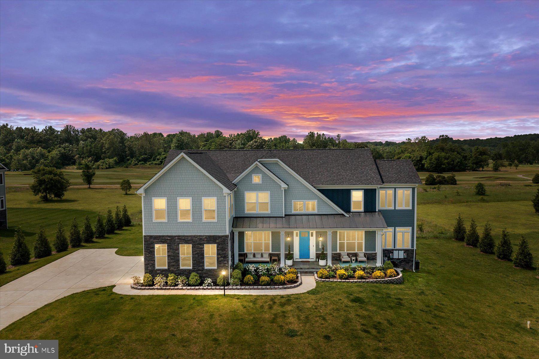 Come visit this home that graces a golf-course community with picturesque views and stunning sunsets. This beautiful appointed estate home sits on a vast lot backing to the Renditions Golf Course. With an expanded driveway, a front porch with an expansive sitting area, a three-car garage with electric car configuration, a gorgeous tree surround, solar panels, and a manicured lawn - this home is a beauty and tells a story from the minute you drive up! This Caruso-built farmhouse features impeccable custom details including recessed lighting, cofferred ceilings, custom built-ins, a state-of-art kitchen and luxury amenities. The main level offers both formal and casual living spaces, an office, an eat-in kitchen that opens up to the backyard, and a mother-in-law ensuite - all with 10' ceilings and impeccable finishes! The upper level has another entertainment area that you won't forget, along with four bedrooms, and three full bathrooms. The primary bedroom is enormous and features a sitting area, walk-in closet, and an expansive luxury bathroom with dual walk-in showers and a soaking tub. The fully-finished basement is spacious with several entertainment areas, a bedroom with bathroom, and additional storage space. You don't want to miss this one, come see for yourself what words can't adequately describe!