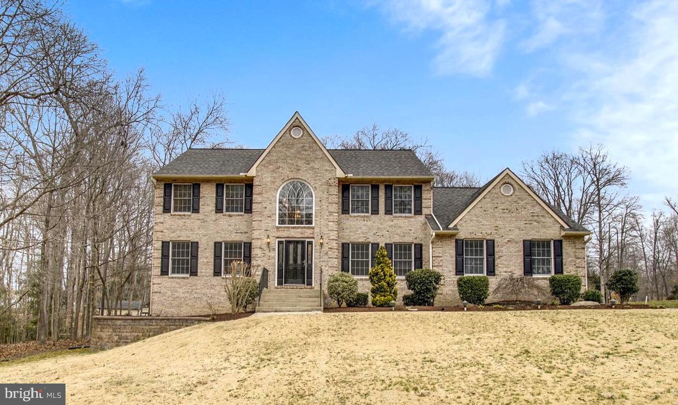 This gorgeous 4bed, 3bath Colonial in highly desired Pheasant Farm is one you won't want to miss! Enter into the welcoming two-story bright foyer and be delighted by this classic beauty that offers a classic layout with hardwood, ceramic and carpet flooring. Immediately fall in love with the spacious freshly painted family room with cathedral ceiling, skylights and stone fireplace with new pellet stove insert.  The kitchen features granite countertops, white cabinets, newer appliances, a large pantry, cooking island and an adjacent mudroom/laundry. The main level is rounded out by an office, living room, dining room and a half bathroom. The primary bedroom suite features two large walk-in closets, linen closet, spacious ensuite bath complete with double-vanity, shower area, and jetted tub. The large walk-out, mostly above grade basement offers natural light, an expansive finished workout room, a full bathroom, french doors that walk out to the pool, rough in for a kitchenette and two large areas to finish as you please!  An over-sized 2 car attached, side-loading garage provides room for cars, a workshop and storage. Situated on 1.33 acres, this brick beauty backs to woods and offers ample space for serene outdoor living, including a fully fenced stamped concrete patio surrounding an in-ground pool, a wood deck off of the kitchen and a flat yard.  Professional land and hardscaping.  One large shed great for all your pool and garden supplies. Private and plentiful! This property has it all! No HOA. Conveniently located and easy commute to Joint Base Andrews, Dahlgren, Bolling AFB, Pentagon, I-495, Washington DC and Virginia.
