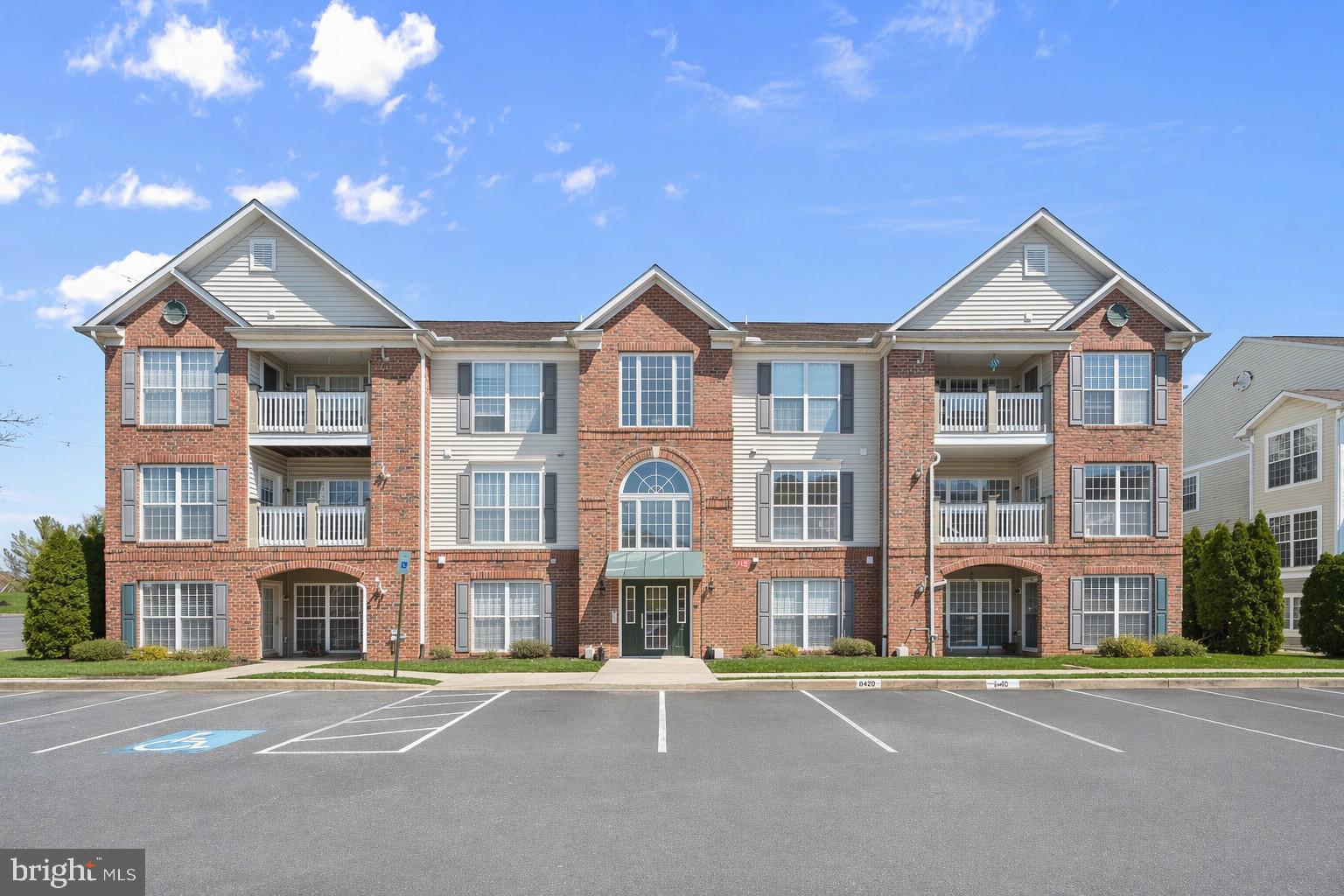 Welcome to the Ridgeview community in Frederick! This second-level unit offers a bright, open floor plan with plush carpeting throughout and abundant storage options. The inviting living area is accented by crown molding and custom blinds. It provides seamless access to the dining space, private balcony, or a flexible area ideal for a home office.  The dining area flows effortlessly into the kitchen, where modern luxury vinyl flooring and natural light enhance the space. The kitchen is well-appointed with a breakfast bar, ample cabinetry, a pantry, and stainless steel appliances, perfect for both everyday living and entertaining.  Retreat to the spacious primary suite featuring plush carpeting, dual closets including a walk-in, and a private en-suite bath with a double vanity and walk-in shower. A second bedroom and full hall bath complete the sleeping quarters.  Residents enjoy community amenities, including a pool and playground, as well as convenient access to major commuter routes such as I-70 and I-270, providing easy travel to Washington, D.C., and downtown Baltimore.