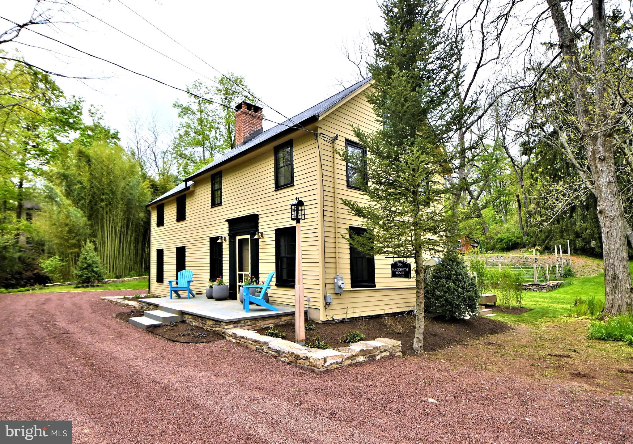 ***Open House Saturday, May 30 - 1:00-3:00pm***Situated in the heart of the charming Carversville Village Residential District  sits this magnificent, unique, completely renovated and reimagined Federal Style historic homestead, known as Blacksmith House - Circa 1852. The spectacular  3/4 acre+ manicured lot is blessed with a tranquil meandering branch of the Paunacussing Creek,  providing the perfect peaceful complimentary backdrop for this enchanting treasure. Once under the ownership of James Shaw, the noted town Blacksmith and entrepreneur, generations have come to appreciate the beauty and history of this captivating location and property. Today, a gorgeous flagstone front porch (20'x8') welcomes you to the elegant entrance, where gleaming original pine floors and meticulous trim and raised moldings will immediately capture your eye. The gourmet kitchen features white maple cabinetry, subway tiled backsplash, Wolf, Jenn Air, Bosch stainless steel appliances with gas cooking ( downdraft range venting ), giant quartz island with seating for 2, and an alcove  for a table and chairs, all accented by a classic brick surround fireplace.  A large pantry,  laundry room with utility sink, stacked Miele washer & dryer, and powder room  offer everyday modern and spacious conveniences. The sun filled Great Room, with Bucks County fieldstone  fireplace and wood burning stove, offers beautiful views in all directions and provides access to the stunning EP Henry paver patio/walkway and 40' long Azek composite deck , offering the ultimate in outdoor relaxing, dining, and entertaining  in total privacy with long distance views.  Back inside,  make your way to the second floor on a beautiful hand crafted oak staircase, with trim paneled  walls, period appropriate spindles, and pine treads. The Primary Bedroom is large with great views, scraped maple floors and closet with built-ins. The Primary Bath features a tiled shower and vanity with quartz counter. Bedrooms  2 and 3 are bright and airy, sharing a convenient hall bath with tub shower. A spacious walk up floored attic offers additional storage space. The incredibly immaculate property features a vast array of colorful annual and perennial plantings, heathy and mature trees, stone walls, and a rarely found length of creekside tranquility to enjoy year round in a magical park like setting. Other outstanding items of note are recessed lighting throughout, black accent window frames inside and out, 50 year architectural roof, baseboard hot water zoned heat, central AC, Viessmann furnace and water heater, multi filtered reverse osmosis water, 200 amp electric service and much more. Just unpack your bags and enjoy the good life in a truly amazing tranquil atmosphere. Whether as a Full Time Residence or a Soothing Weekender Oasis, This Magnificent Property can be Yours! Village is located in the New Hope - Solebury SD,  with a Doylestown mail delivery address, or a Carversville P.O. Box  address. Just minutes from New Hope, Peddlers Village, Doylestown, Point Pleasant, Ralph Stover State Park and Delaware River activities and bridges.