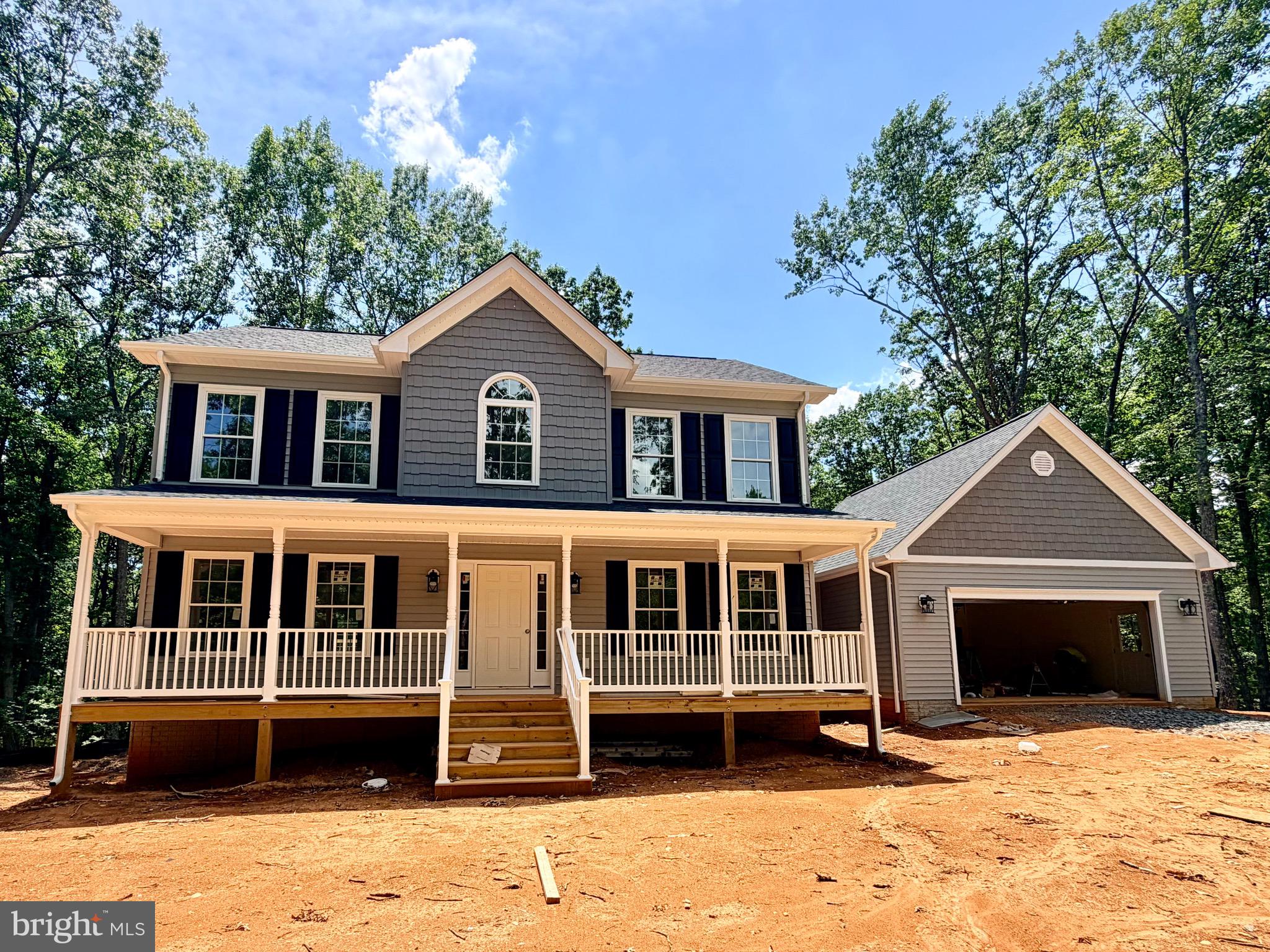 UNDER CONSTRUCTION-MID JULY COMPLETION -BRANDY MODEL - Lot 2 -Beautiful 3.3 acre lot.  Colonial style home with covered front porch is surrounded by mature trees. Features Beautiful LVP Flooring throughout the main and upper level hallway with carpet in the bedrooms, stone fireplace in living room, granite counter tops and stainless steel appliances in the kitchen, bright spacious breakfast area, separate formal dining room, large laundry room on the main level. Full unfinished, walkout level basement and a 2-car attached garage.  Call for more information.  FYBERLYNC Available! Please call Fiberlync for more information and confirmation.