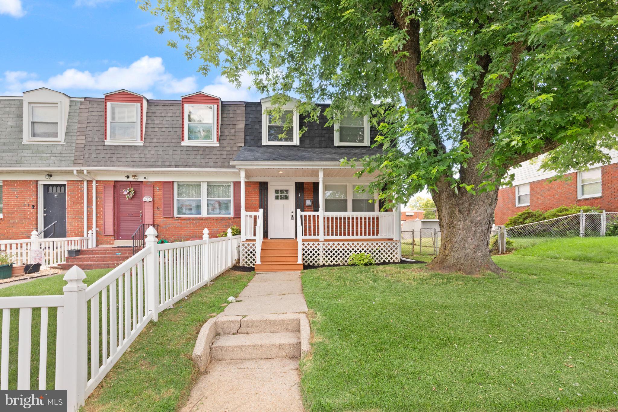 Welcome to this fully reimagined 3-bedroom, 2-bathroom end-of-group townhome. Every detail has been meticulously updated, featuring a brand-new roof, new windows, and Air Conditioning.  Bright, open floor plan highlighted by gleaming, refinished hardwood floors and a fresh, neutral paint palette throughout. The kitchen stands out, boasting custom soft-close shaker cabinetry and stainless steel appliances. Upstairs, you will find modern finishes including upgraded 2-panel doors and a remodeled bathroom.  The fully finished basement adds exceptional value and versatility, offering an expansive recreation area, dedicated laundry, and a second full bathroom. Outside, enjoy the best of both worlds with a welcoming front porch, a private rear deck for entertaining, and a large yard with convenient off-street parking. This home offers the rare combination of turn-key reliability and elevated design—schedule your private tour today!