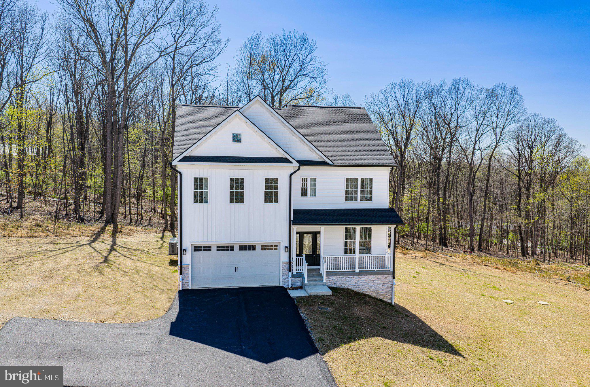 Location and Privacy! This newly built home sits on 1.47 acres just outside of Westminster city limits! It is one of three new homes on a quiet street with no thru traffic and no HOA.  Seller is offering $10,000 in seller's help at closing!

The inviting open floor plan on the main level connects the kitchen, dining, and living areas, which accommodates both entertaining and everyday living.  The main level boasts a half bath, large coat closet, lots of windows, a view of the woods, laundry room, and walk-in pantry.  

The upstairs level has four generously sized bedrooms (one with an on-suite bathroom) and a master suite with a large walk-in closet, a spa-like bathroom complete with a soaking tub and a walk-in shower, double vanity, and a view of the woods. The finished walkout basement, with its side entrance and a daylight window, offers endless possibilities with a large recreation room, home office/additional living space, and a full bathroom.  Outside, the property features a newly paved driveway, attached garage with front entry, and ample driveway space for guest parking. 

The peaceful lot, situated on a no-thru street, enhances privacy and tranquility, making it an ideal setting for outdoor gatherings or quality family time.  Experience the perfect blend of comfort, elegance, privacy, and nature in this stunning property, where the higher-end finishes were thoughtfully selected for the discerning homeowner.