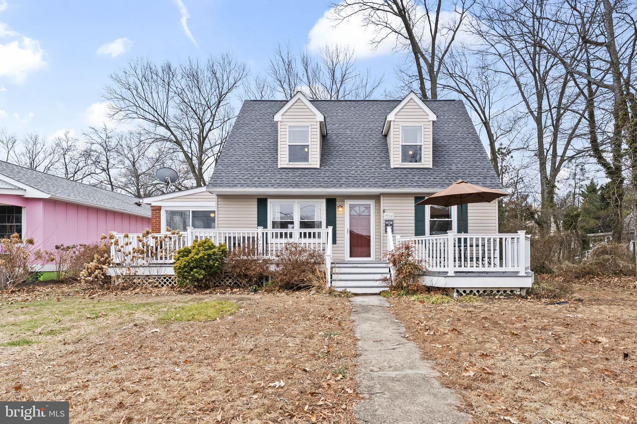 Welcome to 916 Bryant Avenue—charming, coastal, and ideally located in the heart of Colonial Beach. Just a block from the Potomac River, this 4-bedroom, 2.5-bath Cape Cod offers water views, timeless character, and the relaxed waterfront lifestyle the community is known for. Brand new roof installed.

Inside, hardwood flooring and an open, inviting layout create warmth throughout the main level. The first floor features two bedrooms, two bathrooms, a comfortable living area, and a bright eat-in kitchen designed for everyday ease. The enclosed porch, now a sunroom, offers the perfect space for morning coffee, while the spacious front deck invites you to enjoy river breezes and sunset views.

Upstairs, two additional bedrooms share a full bath, offering flexible space for guests, a home office, or hobbies. The backyard features a  detached two-car garage which  includes a finished loft above—ready to be customized to fit your lifestyle.  A private rear patio completes the setting, perfect for entertaining or unwinding after a day at the beach.

Colonial Beach is a vibrant waterfront town known for its golf cart-friendly lifestyle, sandy beaches, fishing pier, boardwalk, marinas, local boutiques, breweries, coffee shops, and waterfront dining. Community events, farmers markets, and seasonal festivals create a welcoming small-town atmosphere just a short drive from Northern Virginia and D.C.

Whether you’re seeking a full-time residence, weekend retreat, or investment opportunity, 916 Bryant Avenue offers coastal charm in a community that feels like a getaway year-round.