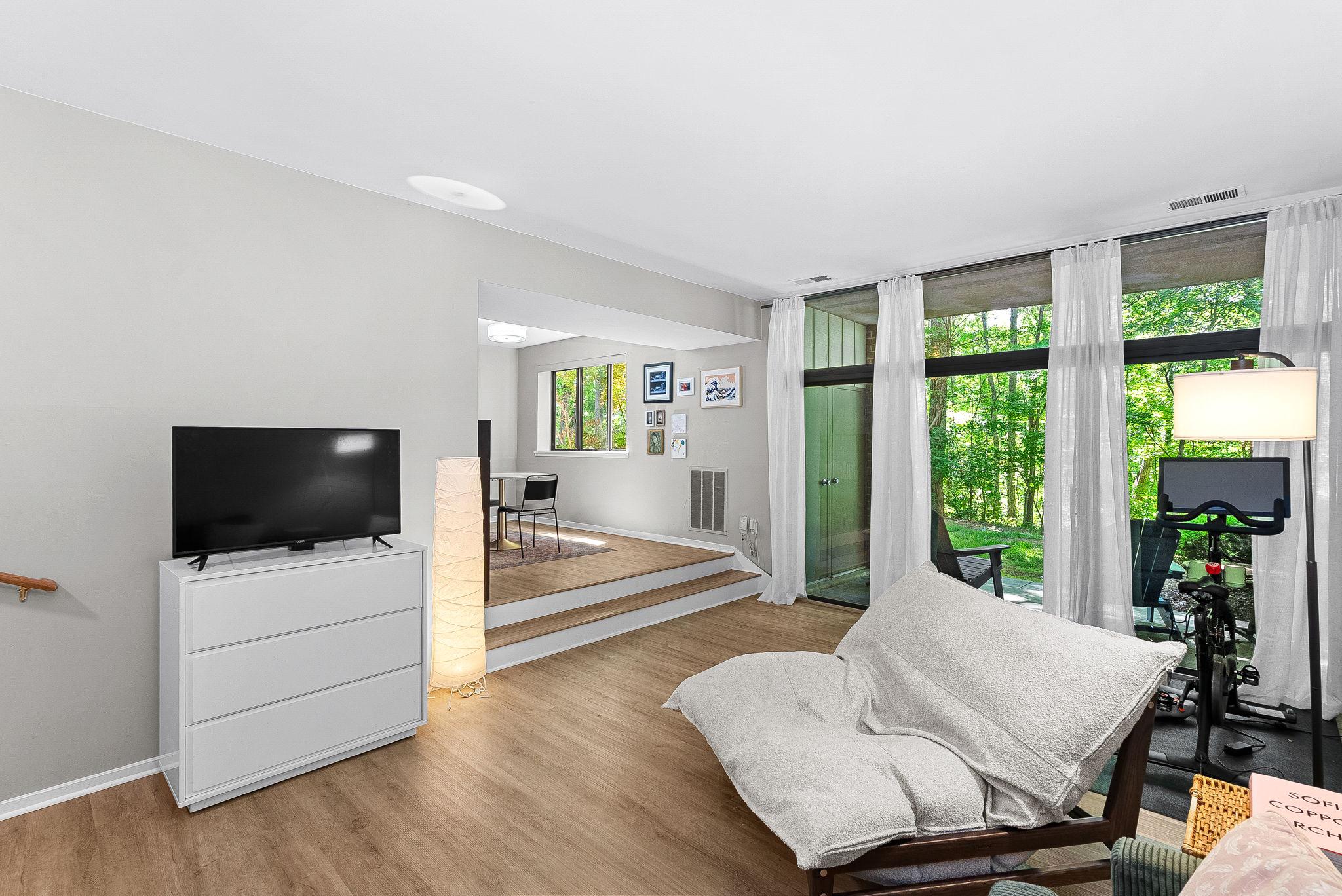 Best value in Reston! Rarely available 945 sq ft condo offering the perfect combination of wooded privacy, direct trail access, and walkability to the Silver Line Metro plus a highly coveted covered parking space! Larger than most Reston 1-bedroom condos, this move-in ready home delivers exceptional space, convenience, and low-maintenance living with ALL utilities included in the condo fee except cable/internet.

Nestled in one of Reston’s most desirable condo communities, this quiet 1-bedroom, 1-bath home backs to the protected forest surrounding Colvin Run, with direct access to Reston’s extensive trail system connecting all the way to Lake Fairfax. Enjoy peaceful wooded views from the private patio while still being minutes from Reston Town Center, Metro, shopping, dining, and major commuter routes.

Inside you’ll find newer LVP flooring, an updated modern kitchen, floor to ceiling windows, and a spacious open layout rarely found in comparable 1-bedroom condos. Additional updates include HVAC replaced in 2016 and washer/dryer replaced in 2025. Desireable covered assigned parking spot just steps from the front door conveys.

Community amenities include beautifully maintained grounds, snow removal, and access to all Reston Association amenities.

A rare opportunity to own one of Reston’s larger 1-bedroom condos in an unbeatable location combining nature, convenience, and value.