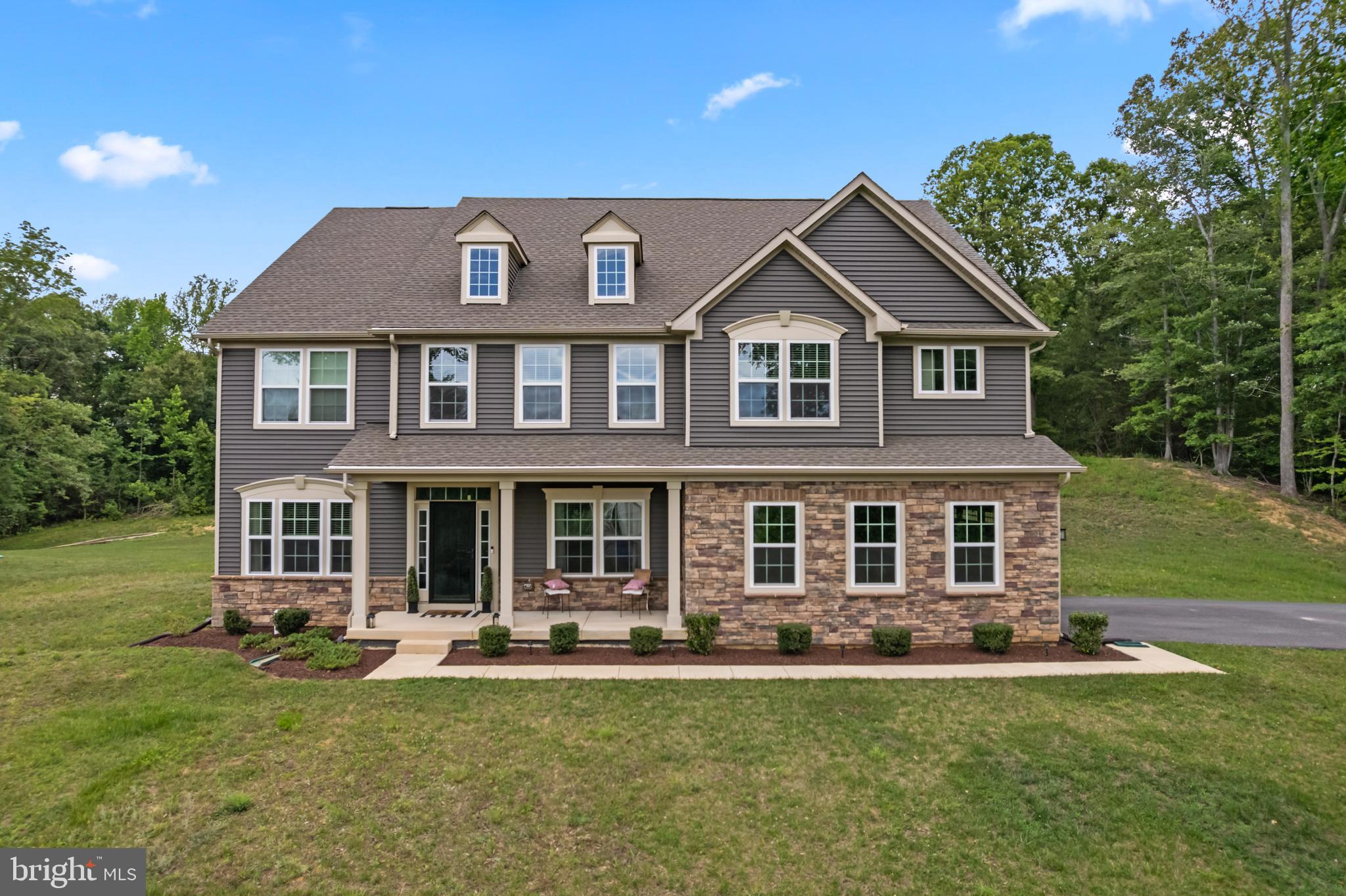 Welcome to The Versailles — a 2023-built, 6-bedroom, 4.5-bath estate home where classic elegance meets modern luxury, set on a private acre-plus lot in the coveted Royal White Oaks community. From the sun-drenched foyer to the grand two-story family room, every space is designed to make an impression.

At the heart of the home, a gourmet kitchen anchors an open, light-filled main level, while a first-floor guest suite offers welcome comfort and privacy — ideal for visitors or multigenerational living.

Upstairs, a versatile loft connects generously sized bedrooms and a magnificent primary suite, a true retreat complete with a private sitting area and dual walk-in closets.

The fully finished lower level adds 1,912 square feet of flexible living space and a full bath — perfectly suited for a media room, home gym, recreation area, or additional guest quarters.

Beyond the home, Royal White Oaks offers a peaceful, wooded setting of acre-plus homesites, delivering space and serenity just 20 minutes from the shopping, dining, and conveniences of Waldorf and Brandywine.
Schedule your private tour today and experience The Versailles for yourself.