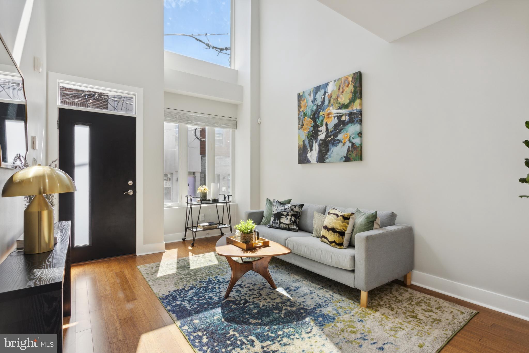 Step into this custom home with a two-story entrance where natural light cascades through oversized pane windows into a spacious living area. At the heart of the home, an updated kitchen opens seamlessly into a private, fenced outdoor patio—perfect for intimate gatherings or a quiet retreat.

Ascending to the second floor, discover two generously sized bedrooms accompanied by a well-appointed full bathroom. The third floor unveils the expansive primary suite and bathroom. Conveniently located on this level is the laundry room, adding to the thoughtful layout of the home.

Above it all, a spectacular rooftop deck offers unparalleled views of the Philadelphia skyline, providing a stunning backdrop for relaxation or entertainment. The finished basement enhances this home’s appeal, offering flexible space that can be adapted into an office, home gym, or art studio, tailored to your lifestyle needs.

Situated in the vibrant heart of Fishtown, this home is just steps away from popular locales such as the Philadelphia Brewing Company, Martha, Picnic, and Meetinghouse. Experience the best of urban living in a sought-after location. Schedule your showing today and envision your new beginning in this exceptional property.