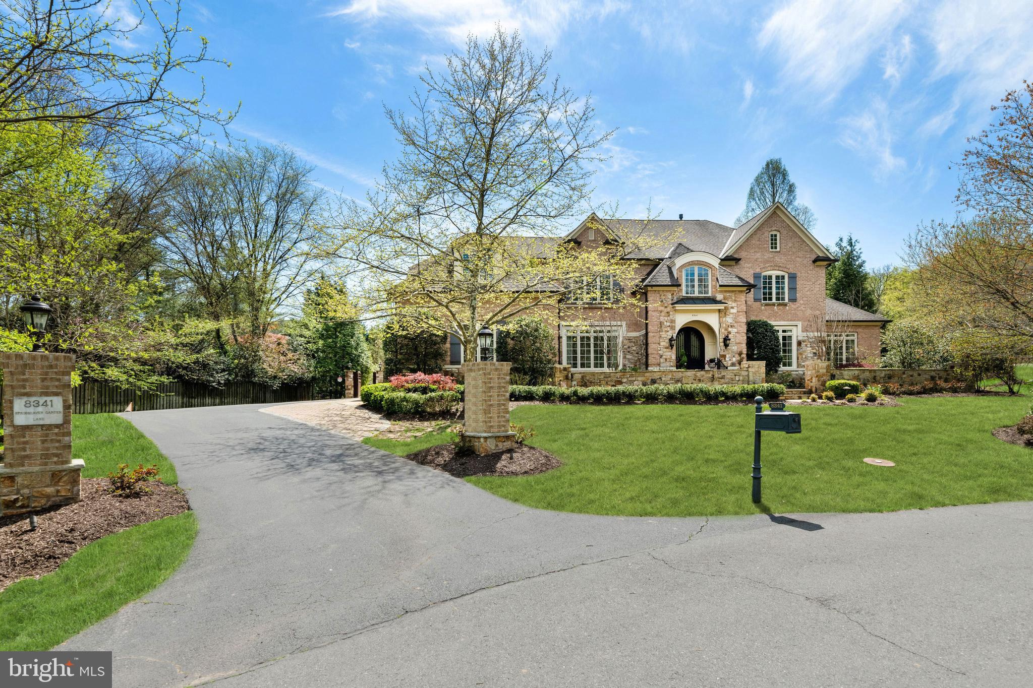 This elegant stone and brick manor home is a jewel nestled on a charming cul-de-sac with serene landscaped grounds and a Rockstar flat backyard!  Rediscover elegance when you enter the gracious 2-story Foyer with curved staircase. The Main Level includes a Formal Living and Dining Rooms with beautiful mouldings, Butler’s Pantry with wine cooler, Great Room that has floor-to-ceiling windows with dramatic fireplace and custom built-in cabinetry, gorgeous Library with custom built-in cabinets, a Sunroom that is perfect for a Music Room, secondary Office or Playroom. The Chef's Kitchen is totally renovated with custom cabinets, top-of-the-line appliances that includes Viking Range with 8 burners and 2 ovens, side by side full size Refrigerator and Freezer, built-in microwave and ovens and built-in coffee machine. There is a large center Island, exotic stone countertops, walk-in Pantry, Breakfast Area with access to the outdoor covered kitchen with retractable screens that takes it from a covered patio to screened in porch, perfect for entertaining. The Main Level also includes Formal and Family Powder Rooms, Mud Room with cabinets, sink, cubbies and access to the unique 3- car garage with two car lifts. The Upper Level has an elegant Owner’s Suite, sitting area with Fireplace, renovated Spa Bath with steam shower and multiple shower heads, double vanities, large tub, amazing designer walk-in closet and 2 additional walk-in closets with custom built-ins. There are 3 additional en suite Bedrooms on the Upper Level. The Lower Level has a large Recreation Room with fireplace, fantastic custom Bar with full Kitchen, Game Room, Movie Room, fabulous Wine Cellar, Bourbon Room, Gym, Bedroom and Full Bath. The truly resort backyard is great for entertaining or just family fun. There is an outdoor covered Kitchen, fireplace with TV, automatic retractable screens. The state-of-the-art saltwater pool  with waterfountains and limestone patio area, separate pool Bath, and an amazing, large flat lawn area. Whole house generator is included. Minutes to dining, grocery stores and the finest shopping in the Washington area!