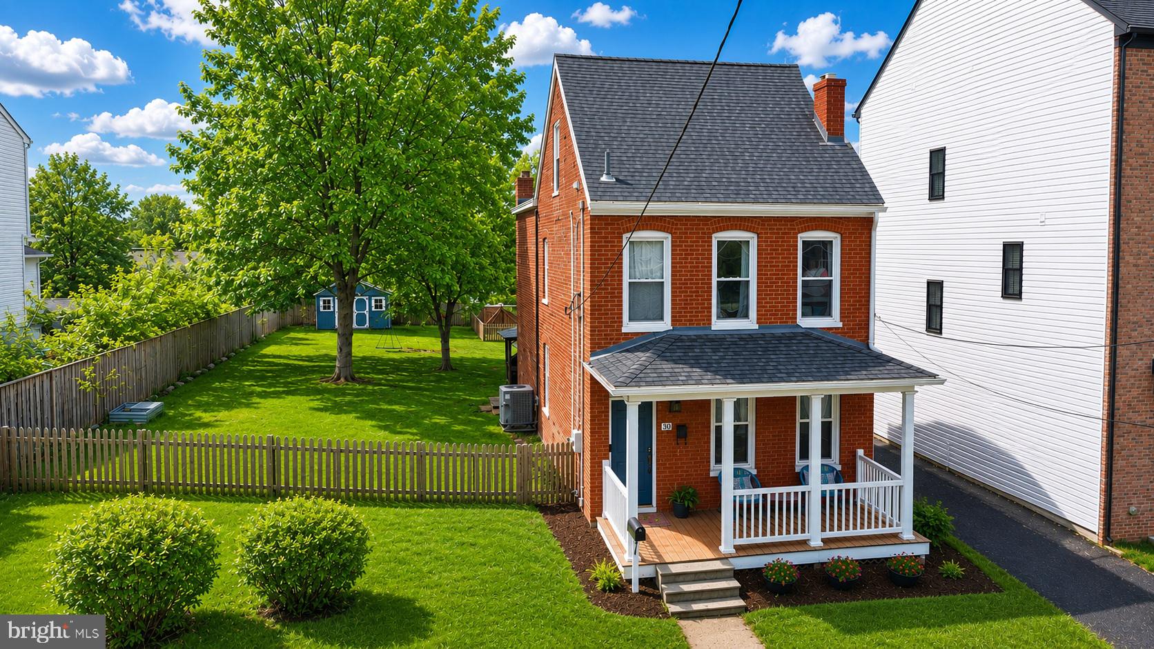 Welcome to 30 Hamilton Ave! This charming red brick home with inviting front porch sits on a double lot, a rare find in downtown Frederick. Upon entering the home into the family room, you notice beautiful hardwood floors that span across the entire main level. A dining room leads to the gorgeous kitchen with updated countertops, cabinets, stainless steel appliances and farmhouse sink. A half bath and laundry area complete the first floor. Upstairs the hardwood floors continue with two bedrooms, a full bathroom, and newly created study space. The recently finished attic space makes the third bedroom. The basement area provides extra storage space. The backyard has tons of space for outdoor living, grilling, gardening, or kids and pups to play. The home has a shared driveway but private space to park multiple vehicles. Conveniently located downtown, close to restaurants, shops, breweries, parks, Carroll Creek and walking distance to The Great Frederick Fairgrounds. This is a rare find you do not want to miss!