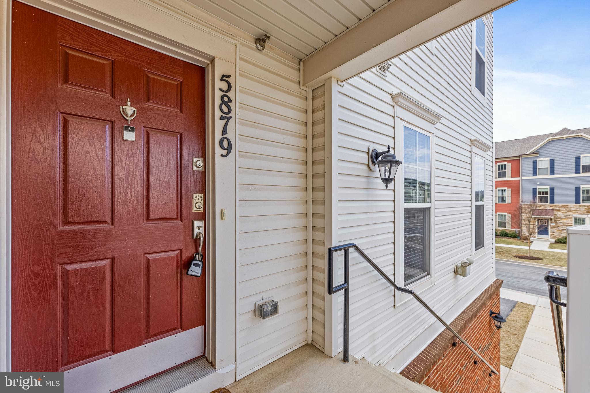 5 years new, this beautiful end-unit 3-level townhome with a 1-car garage is ready for a new owner!  The main level features hardwood floors throughout. The wrap-around kitchen has a breakfast bar and all granite counters., Stainless steel energy-efficient appliances to include a gas range.  
The living and dining areas have lots of sunlight and a deck off the living room.  The 2nd level features a full bathroom and 2 bedrooms that are large enough for a queen-size bed.  The 3rd level is the primary bedroom suite, which consists of a private bathroom with a soaking bath-tub, a double vanity with granite counter,  a separate shower stall, and a large walk-in closet.  There is also a Laundry closet with an energy-efficient washer and dryer.