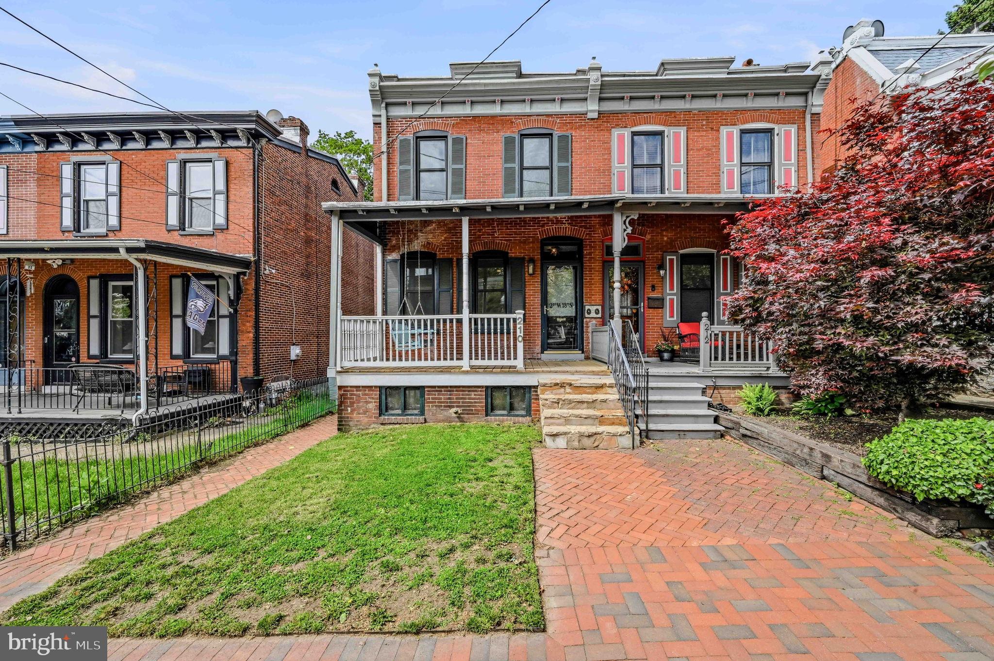 Welcome to this tastefully updated, move in ready 3-bedroom, end of row townhome in Wilmington. This gem is an exquisite blend of classic design and modern comfort. The open floor plan and exposed brick seamlessly connects the rooms making it perfect for entertaining and easy living. Enjoy cooking in the updated kitchen with granite countertops, a plethora of storage space, kitchen cabinet organization systems, gas cooking and stainless steel appliances. The separate main level laundry room also serves as a pantry, providing additional storage. Original hardwood floors enhance the charm of the interiors and create a warm and inviting ambiance throughout the home. The private primary bedroom is a peaceful haven with hardwood floors and features a covered porch where you can relax and unwind. The updated full bathroom strikes a balance of luxury and functionality with a soaking tub and large walk-in shower giving a spa-like experience. Two additional bedrooms complete the second floor. The home also features a finished basement that can be tailored to fit your needs. The home's exterior is equally captivating with a beautifully maintained private fenced yard and a covered front porch adds to the appeal of this home, offering cozy spaces for outdoor relaxation. Situated within walking distance to Brandywine Park, Zoo, Rose Garden, hospital and restaurants. This property is a masterful integration of vintage charm with modern updates.