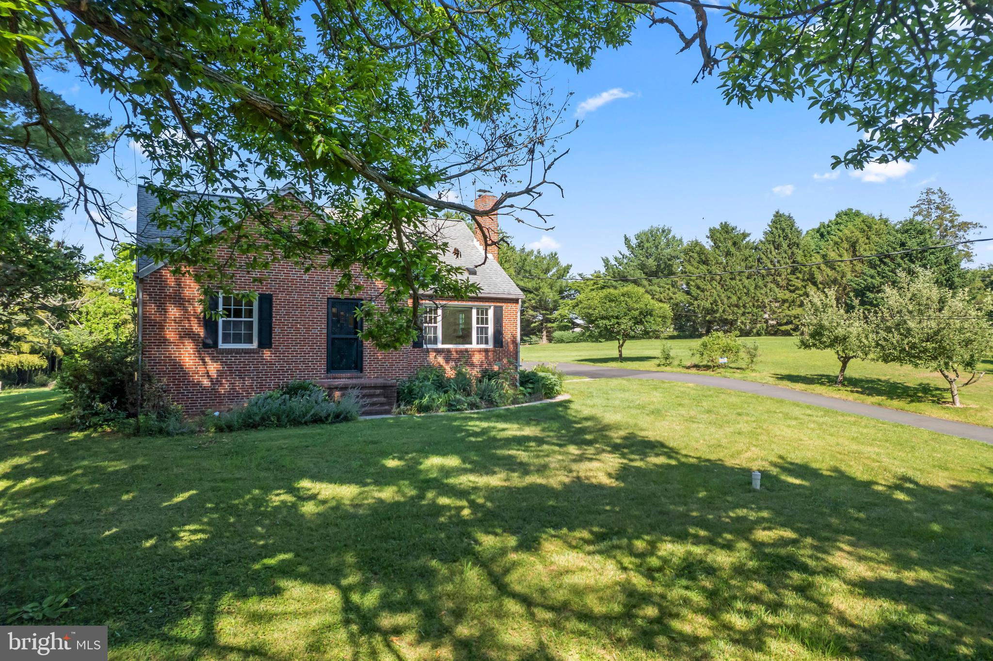 Solid brick cape cod residence with four bedrooms and two baths nestled on a quiet one acre partially wooded lot within a quarter mile of Patapsco State Park. The main level of the home has been freshly painted and the oak hardwood floors have been refinished. The galley kitchen is adorned with granite countertops, wood cabinets, and stainless-steel appliances. Also complementing the main level are arched openings into the formal dining room and the cozy living room with a brick hearth and mantled wood burning fireplace. Two spacious bedrooms and one full ceramic bath complete the first floor. The second level houses the master suite with vaulted ceilings and a walk-in closet. The partially finished basement has a flexible space that can be used as a fourth bedroom, family room, or recreation room with a second full bathroom, a huge workroom, and a separate utility/storage room. Enjoy outdoor time in the beautiful yard, gardens, 10' x 12' glass Janco greenhouse, and on the expansive 21X15 covered brick patio with a built-in outdoor fireplace. The exterior is also accompanied by a detached oversized two-car garage. This Howard County home is served by a private well and septic, along with 300 AMP electrical service, suitable for solar. Ideally located and easy access to highly rated schools, abundant shopping, dining, and entertainment options. Convenient to historic Ellicott City, Clarksville, Columbia, Savage, Baltimore, Annapolis, and Washington DC, and within close proximity to BWI, FBI, NSA, NASA, SSA, MARC rail and major commuter routes. Come visit the Open Houses on June 13th and 14th from 1-3 PM.