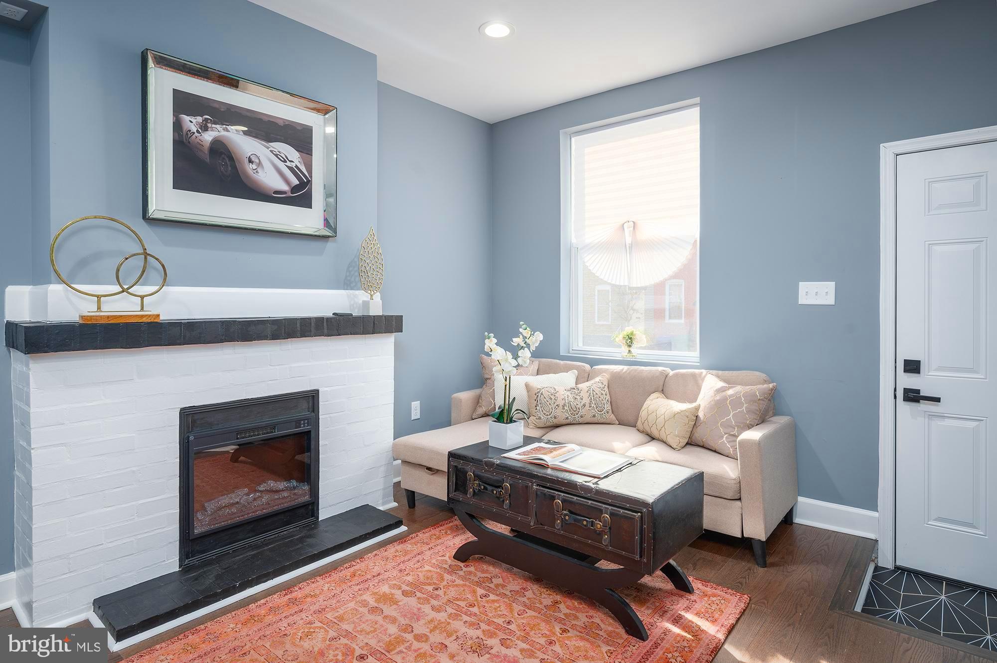 Welcome to 1125 Scott St - fully renovated home ready for its new owner. This impeccably designed home has it all: The main level welcomes you with a cozy living room featuring a fireplace and a custom brick mantle, solid wood floors throughout, leading you into a dining area, as well as a gourmet kitchen with timeless classic white shaker cabinets, Calcutta countertops and stainless appliances. Second floor boasts with to en-suite spacious bedrooms and beautifully designed bathrooms. Lower finished level is a perfect space for guest quarters and a home office. Additional perks are - Off-street PARKING, brand new electric, plumbing and HVAC, and more. Centrally located in Washington Village, close to Federal Hill, downtown, stadiums and all major highways.