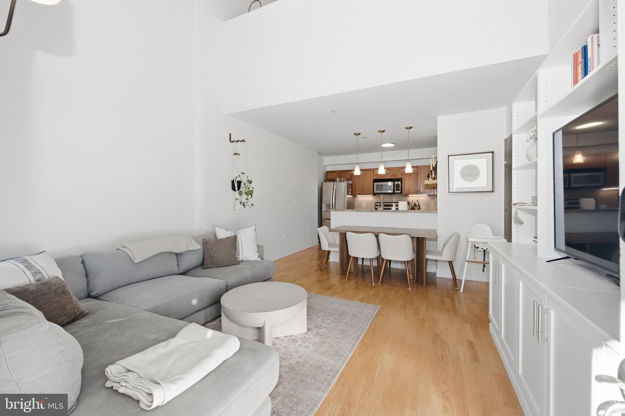 Welcome to Unit 313 at Naval Square's iconic Biddle Hall, where historic character meets modern comfort in one of Philadelphia's most sought-after gated communities. This beautifully updated 2-bedroom, 2-bath residence includes a coveted covered parking space and offers an exceptional blend of style, convenience, and amenities.

Step inside to discover soaring vaulted ceilings, an open and airy layout, and abundant natural light throughout. Recent improvements include fresh designer paint, custom wall cabinetry, and numerous additional upgrades that enhance both functionality and appeal. The spacious living and dining areas flow seamlessly into the kitchen, creating an ideal setting for everyday living and entertaining alike.

The thoughtfully designed floor plan features two generously sized bedrooms and two full bathrooms, providing flexibility for guests, a home office, or roommates. Additional conveniences include in-unit laundry, ample closet space, and dedicated covered parking.

Residents of Naval Square enjoy access to an impressive array of amenities, including a resort-style outdoor pool, state-of-the-art fitness center, concierge services, beautifully maintained green spaces, walking paths, picnic areas, and a welcoming community atmosphere. Ideally situated between Center City and University City, you're just minutes from CHOP, HUP, Penn, Drexel, the Schuylkill River Trail, Fitler Square, Rittenhouse Square, and some of Philadelphia's finest dining and shopping destinations.

Experience maintenance-free living in a historic setting with all the benefits of a premier gated community. Schedule your private showing today and discover everything Unit 313 has to offer.