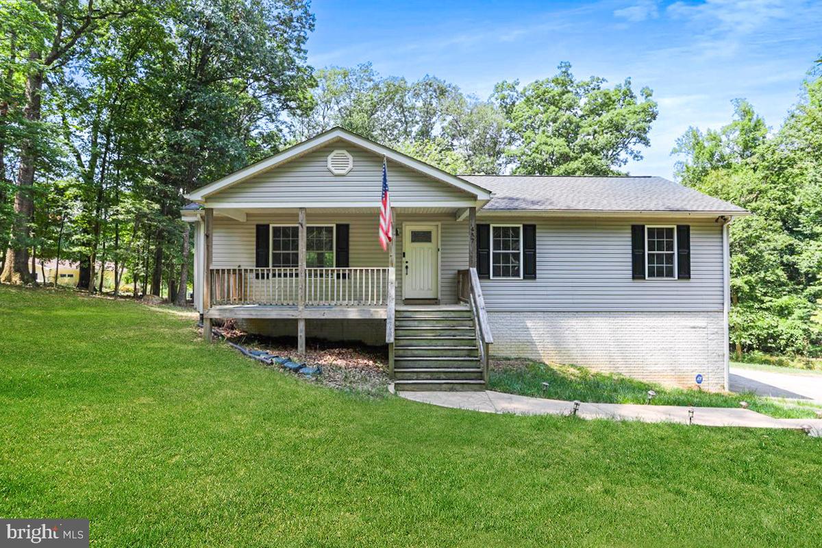 This charming 3-bedroom, 3-bath rancher on 1.24 acres in the desirable Shannondale/Harpers Ferry area offers both comfort and convenience! The inviting family room features real hardwood floors and a beautiful stone fireplace, perfect for cozy evenings. The eat-in kitchen/dining area boasts newer stainless steel appliances, and all 3 bedrooms are conveniently located on the main level, each equipped with ceiling fans. The primary suite includes double sinks and an extra closet for added storage.
The fully finished walkout basement has  a 3rd full bathroom and provides plenty of extra living space. Recent updates include a Culligan Reverse Osmosis Water Treatment System (2021), a new roof, and an HVAC system replaced in 2019. Additional features include a paved driveway, a large 2-car garage, a spacious yard with an extra lot, a welcoming front porch, and a back deck with a stamped concrete patio. No HOA, high-speed internet, and a private yet convenient location just minutes from the VA/WV line make this home a must-see!