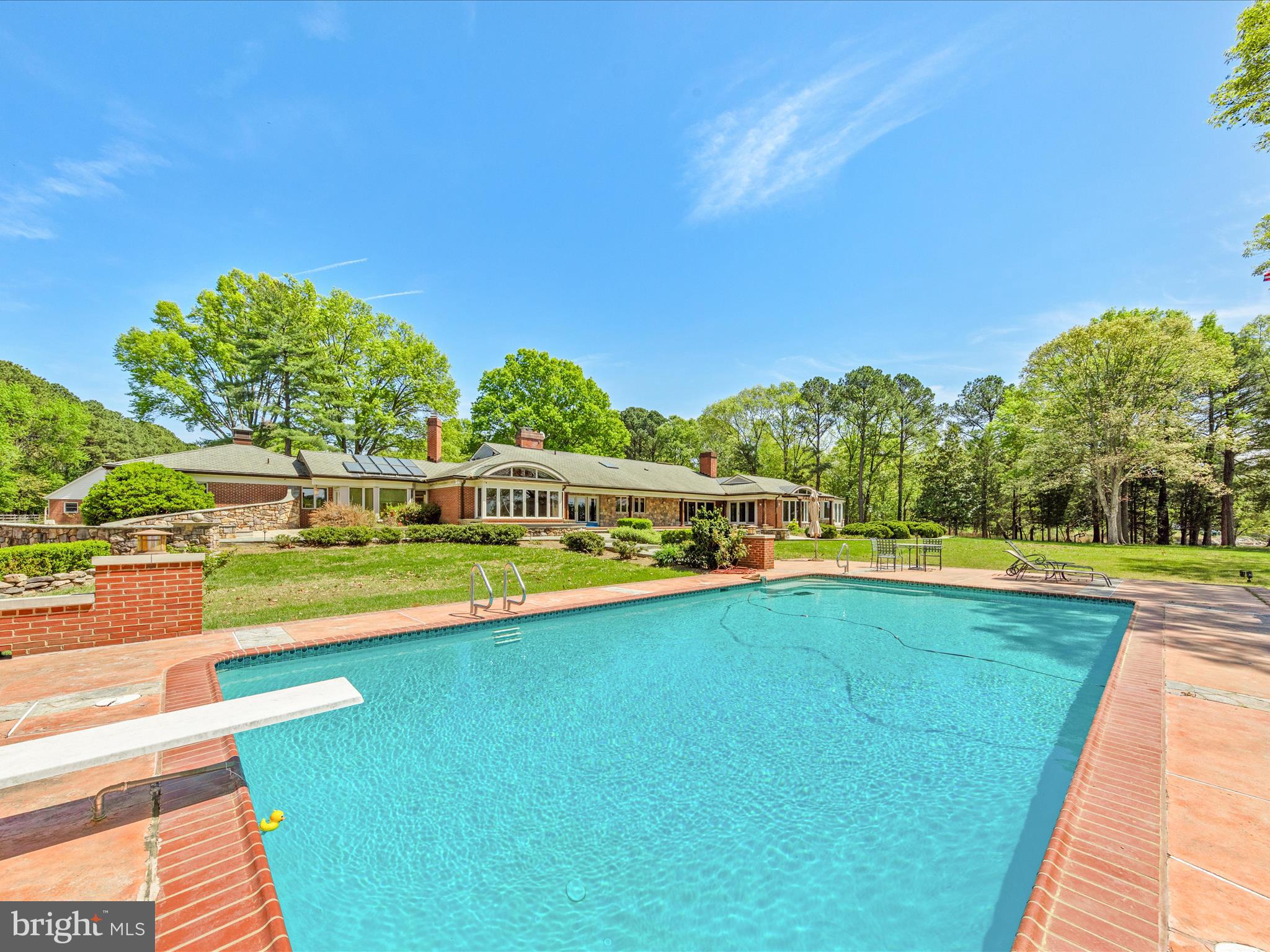 Welcome to Soleil on the Bay! Nestled on nearly 7 acres along the calm, deep waters of Maxmore Creek—just off the Tred Avon River—this exceptional west-facing waterfront property offers the most gorgeous sunsets and wide-open water views providing the perfect blend of privacy, natural beauty, and endless potential. Ideally located between Easton and St. Michaels, it provides easy access to the best of Maryland’s Eastern Shore.

Enter your future family estate down a beautiful, private, tree-lined, fully paved driveway.  Extensive site planning and improvements have already been completed, and the County and MDE have approved a septic expansion to support up to 8 bedrooms.

The estate is beautifully appointed with mature trees, a 20’x40’ waterside pool, and a brand-new, 185- foot, deep-water dock featuring 6’ mean low water, floating docks, fully connected with electrical and water, a jet ski lift, kayak launch, and a 20,000+ pound boat lift with 30 amp, 220 electrical outlet to charge your boat. Two charming guest cottages totaling approximately 2,600 sq. ft. have been remodeled and enhance the property; providing unique opportunities each with its own fully equipped kitchen and multiple bedrooms and bathrooms.  Includes oversized 3 car attached garages. Imagine your friends and family enjoying their own cottage for the utmost in privacy on this family compound.

Additional highlights include 550’ of rip-rapped shoreline, extensive stone hardscaping, brick and paver walkways and patios, and a paved blacktop driveway, making this an extraordinary offering with unlimited potential in a prime waterfront setting.  The grounds are mostly flat with available buildable lot coverage.

The main residence needs to be remodeled or rebuilt and presents a unique opportunity to create your dream home. Architectural plans are already in place for a stunning new main house or design your own dream home.

Easton, Maryland, known as the New Hamptons of the Chesapeake Bay by Forbes Magazine, is conveniently located 1.5 hours from D.C. and Baltimore, and 2 hours from Philadelphia. Just minutes from fine dining, shopping, healthcare, theatres, galleries, museums, golf courses, a country club, a yacht club, and a jet airport.