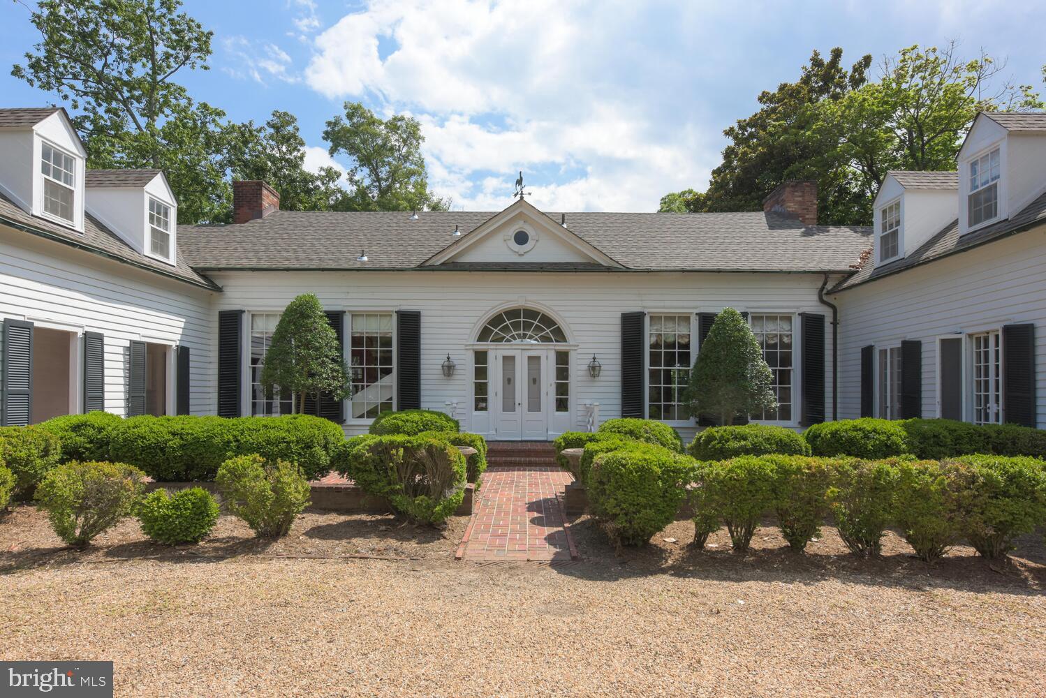 Rare and Remarkable,  Arch Hall is located on a magnificent waterfront parcel of nearly 9 acres overlooking the waters of Belmont Bay, where the Occoquan River joins the Potomac.  Originally located in Alexandria, as the home of George Washington's nephew, Major Lawrence Lewis, and Eleanor Parke Custis, the granddaughter of Martha Washington, Arch Hall was removed and rebuilt in its present location in 1950-1951.  Since then it has had several thoughtful and complementary additions, respecting the classical elements of this 18th century gem.  Gracious, light-filled rooms are highlighted by mellow wood and period details, throughout.  The house offers over 5,000 sf of living space on two levels. The main level features high ceilings and generous room sizes.   A first floor wing is devoted to a primary suite with a bedroom,  full bath and private study. The upper level includes five bedrooms and three full baths and additional storage. 

Awaiting its next chapter, Arch Hall conveys in "As Is" condition.  The main roof has been recently replaced; many of the systems are older, though regularly maintained.

This entire property, including the main house, out buildings and nearly 9 acres,  is  protected by an historic and conservation easement.  Subdivision is prohibited, but the property is magnificent as-is.