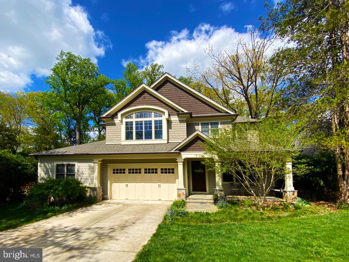 Enjoy living in a superb Bethesda home designed and built by the owner/ architect to meet the need for versatile lifestyles, with high end custom touches throughout, situated on a spacious lot backing to Rock Creek Park. From the moment you enter through the 96” tall wood door your eyes will be drawn to the custom ceiling and wall moldings that adorn the home at every turn. The large home office is located just off the entry foyer for the occasional client meeting. 10 foot ceilings in the family room add to your feeling of space, and the gas fireplace is a beautiful focal point. The gourmet chef’s kitchen is enhanced by stylish light fixtures, beautiful cabinetry and tile work, while offering a 48” range featuring a griddle. A butlers pantry and bar provide for easy entertaining in the spacious dining room. While smaller gatherings take place around the breakfast area with built in bench nook. For most of the year you will enjoy spending hours on the screened porched with vaulted ceiling and wood burning fireplace, while enjoying views of the deep yard with the woods beyond. With multi-generational living in mind, there is a generously sized bedroom suite on the main level, with walk in closet and ensuite full bath (with shower).  Sliders lead you to the patio and peaceful quiet yard. 
As you head upstairs, your eyes will be drawn to a skylight and decorative moldings. The primary bedroom suite with tray ceiling easily accommodates a king size bed and all your furniture, with up-in-the trees views from the many windows. 2 WIC provide abundant clothing space and the ensuite full bath with spa-like shower and jetted tub is breathtaking. The 3 additional bedrooms upstairs include an enormous room with loft, and 2 bathrooms. The laundry room is where you want it, on the bedroom level, and it provides for lots of linen and other storage.
Downstairs a large recreation room is designed for movie night, game night and general fun (space for a pool table!). An exercise room, and the 6th bedroom with 5th bathroom completes the space.
Nothing has been overlooked: from the EV charger in the garage, to the front porch sitting  area with swing, landscape lighting, low maintenance stainless steel gutter screens and Anderson windows, gas hook up for patio grill. The hardwood flooring is unique hickory wood, which can be refinished to your preferred color and sheen. This home encompasses over 6100 sq feet of conditioned space.