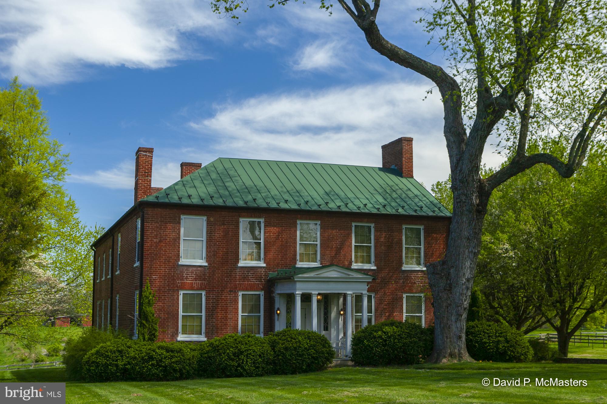 WINDWARD FARM.   EXTRAORDINARY!   Circa 1835 a residential estate/horse farm  of 111 acres  is a well-known National Register property about 1.5  miles from Shepherdstown city line.   One of the last Large Parcels Near Shepherdstown, WV (The National Register nomination form is among the many documents included in this listing. There are also two virtual tours).   This property,  known as the Marshall-Myers-Byron House,   has been owned by the prominent  Byron family for many years.
The primary feature is a well-preserved  1835 L- shaped all brick manor home with 4578  SF of living area on two levels. It's elevated location allows very nice views in  all directions. For those with horses there is a stable-  6 stall horse barn, board fencing and riding ring.  87 acres are leased for agricultural use.  The home
 has 4 bedrooms and 2.5 baths; the  rooms are spacious with 9 foot ceilings .  All interior and exterior doors are solid pine, the floors are yellow pine. There are 10  fireplaces.  An interesting interior feature is the elegant open- string main stairway which rises from the rear of the front hall; allowing a spacious entrance foyer suitable for the placement of furniture in the manner of a living hall. There are enclosed glass porches on both levels, the main level porch is a sun room with  a large deck.  The upper story porch opens off the primary bedroom. The interior has been restored where possible and other interior systems have been renovated and modernized.   The setting is best described as splendid isolation as the home is surrounded by 80 acres of pasture and woods. Yet it is just minutes to Shepherd University, restaurants, shopping and multiple cultural amenities Shepherdstown.  The home is 2 miles from the Potomac River and about  6 miles from the Antietam Battlefield National Park.  Shepherdstown is a favorite destination of many Washingtonians; it features Shepherd University, multiple excellent restaurants and an extremely active arts community. There is a MARC commuter train to DC (station located in Duffields, Shenandoah Junction, 7.6 mi from the house )  with stops in the Maryland "Federal" suburbs and Union Station in DC. 60 miles to the Washington DC beltway .  3.1 miles driving distance to Ferry Hill, National Park Service property, C&O Canal National Historical Park and Potomac Heritage National Scenic Trail.  For recreation it is also easy to bike from the farm to the canal. 
The farm includes a large riding ring,  a 6 stall stable with tack room, board fencing,  and run-in shed. There is ample fenced grazing land.
82 acres is presently leased for agriculture. 
The 111 acres includes 5 additional  saleable lots in two separate locations along the lane which comprise a total of 32 acres. We have attached two tours and multiple other documents to the BrightMLS listing. If your listing provider does not provide them, please let us know and we will send them directly. 
This sale does not include the two Dark Hollow Lots that are part of the listing. They are to be sold separately; thus the price differential.