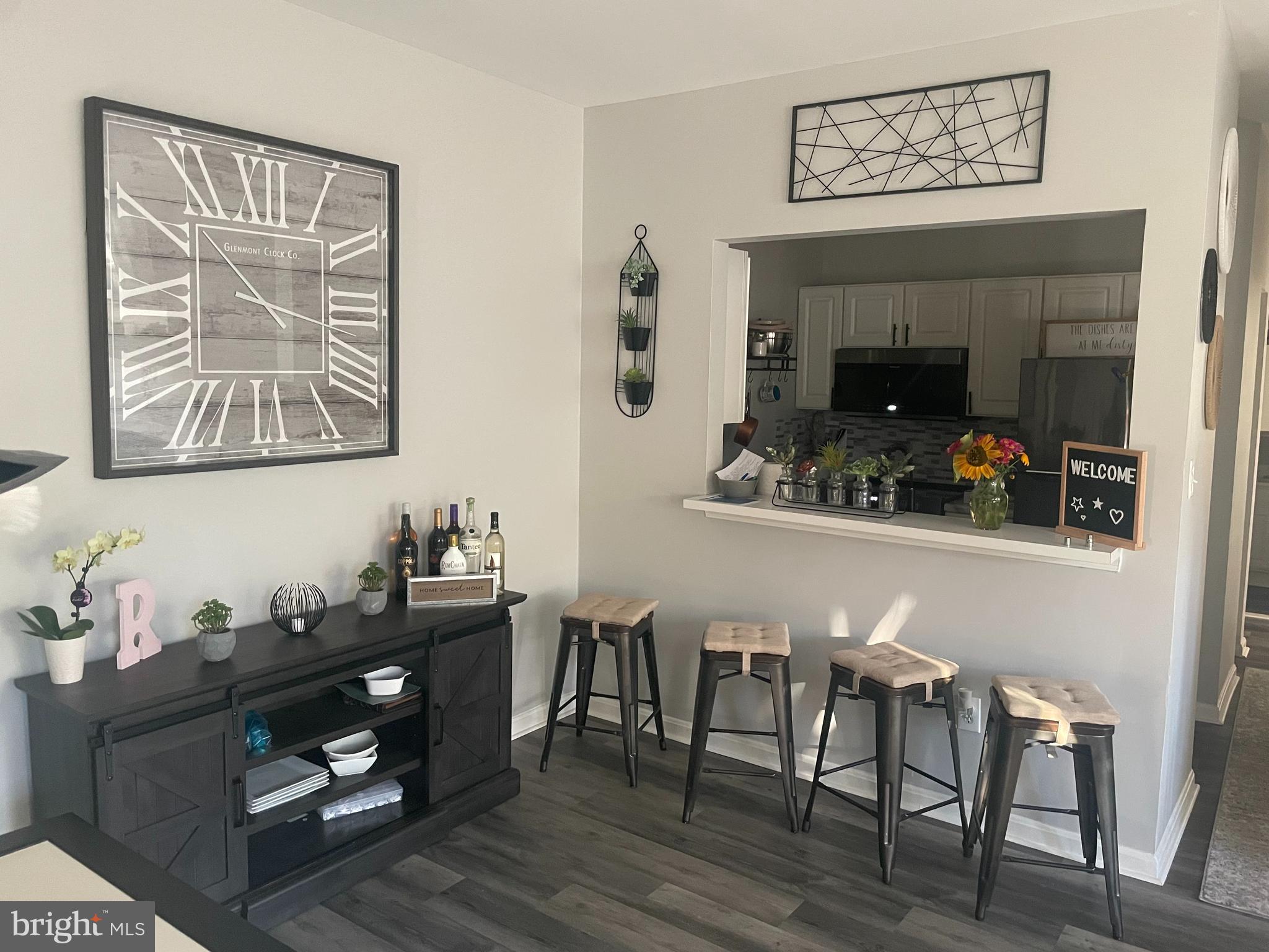 Beautiful 2nd floor Condo located in the desirable community of Lions Gate. This spacious condo has an open floor plan with an updated kitchen, master bath, flooring, and paint throughout.  The large living/dining room combo features a updated fireplace with TV mounted plus a bar height countertop onlooking the updatd kitchen featuring new counter tops. The primary bedroom features a large ensuite bathroom, a walk in closet plus access to the private balcony.. Also included a large second bedroom, a seperate laundry room and hall bath. Comveniently located near major highways and easy access to Ft Meade, DC, Annapolis, Columbia, and Baltimore