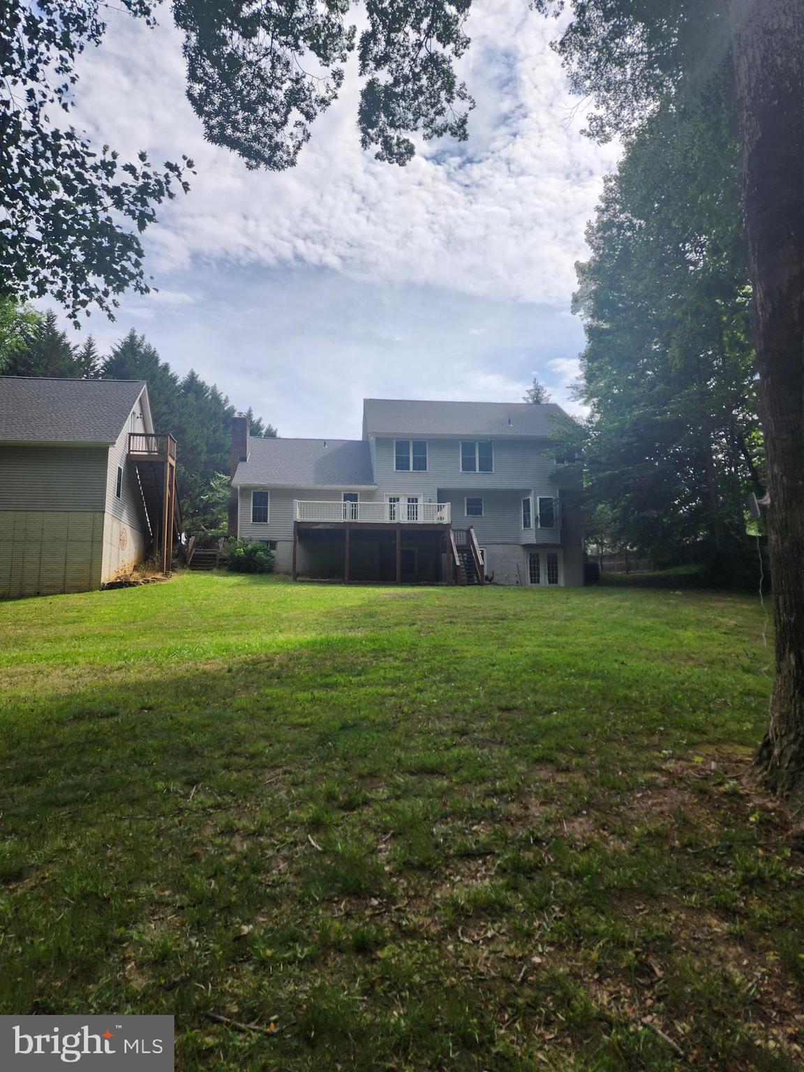 Tucked away at the end of a peaceful cul-de-sac in the highly sought-after Swanson Creek Landing community, this colonial is perfectly situated on 4.4 picturesque acres with a blend of open lawn and mature woods. A winding path leads to a charming bridge and tranquil creek—creating your own backyard retreat. Designed for both everyday living and entertaining, the home features a wraparound porch, a spacious deck, hardwood floors throughout the main level, an updated primary bath with a freestanding soaking tub, and a finished walk-out basement complete with a recreation room, bonus room, full bath, storage, and potential fifth bedroom. Recent improvements include a new roof (2023), HVAC (2022),  a beautiful sliding glass door that allows a ton of light into the kitchen, and a newly paved driveway.
With an attached two-car garage, a detached two-car garage with workshop above, chicken coop, multiple outbuildings, and no HOA, there is plenty of room for hobbies, storage, and outdoor living.  Conveniently located with easy access to Joint Base Andrews, Washington, D.C., Northern Virginia, Metro, commuter park-and-ride lots, and major commuter routes. Outdoor enthusiasts will also appreciate nearby Benedict Community Park, which offers public access to the Patuxent River for fishing, kayaking, and a boat launch. For equestrian enthusiasts,  Maxwell Hall Equestrian Park has over 14 miles of publicly owned equestrian trails.