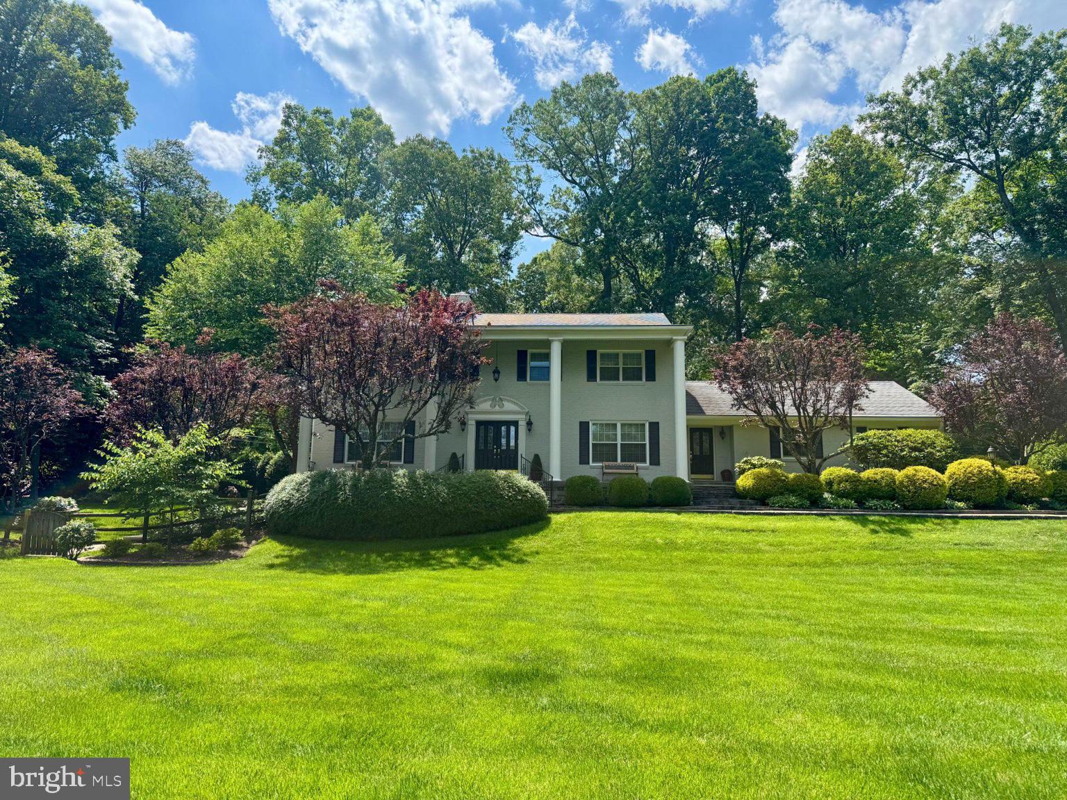 Welcome to one of Great Falls’ most distinguished estates, gracefully positioned within the highly coveted Riverside Manor community. Set on a rare 1.01-acre lot with public water and located within the prestigious Langley High School pyramid, this exceptional residence offers over 6,000 square feet of refined living space, remarkable privacy, and an enduring sense of timeless elegance.

Embodying the coveted old-money aesthetic, the home seamlessly blends classic architectural character with thoughtfully curated modern updates. Extensively expanded and renovated in 2005, the residence reflects a level of craftsmanship and permanence that transcends trends. Rich custom millwork, intricate crown moldings, built-in cabinetry, open floor plan and bespoke architectural details create an atmosphere of understated luxury rarely found in today’s newer construction.

Designed for both grand entertaining and comfortable everyday living, the home features five spacious bedrooms, five full baths, formal and informal gathering spaces, a magnificent custom library, and a chef’s kitchen appointed with premium Wolf appliances, a Sub-Zero refrigerator, dual Miele dishwashers, and a warming drawer. The kitchen opens effortlessly to inviting family spaces that overlook the estate’s mature landscaping and resort-inspired outdoor setting.

The upper level is anchored by a gracious primary suite offering dual walk-in closets and a beautifully appointed spa-like bath. Three additional bedrooms are complemented by two full baths.  For those seeking additional customization, hard-wood flooring preserved beneath the carpeting throughout most of the upper level presents an opportunity to uncover and reveal another classical architectural feature.  The walk-out lower level provides exceptional flexibility with a private guest suite, custom bar, billiards area, family room with a wood-burning fireplace, home theater, and direct access to the outdoor terrace.

Outside, the estate unfolds into a private sanctuary. A heated gunite pool, expansive manicured lawns, towering mature trees, established gardens, and professionally designed landscaping create a setting that evokes the charm of a legacy property, one that would take decades to replicate. Every element has been thoughtfully curated to capture the essence of timeless estate living.

Ideally located just minutes from the Potomac River, Great Falls Park, River Bend Park, Georgetown Pike, Route 7, Tysons, Reston, Dulles International Airport, and Washington, D.C., this extraordinary offering is further enhanced by front and rear irrigation systems, a whole-house generator capable of powering approximately 85% of the residence, and an integrated interior audio system. Rarely does a property combine estate-scale grounds, enduring craftsmanship, modern infrastructure, and a legacy of refined living that never goes out of style.