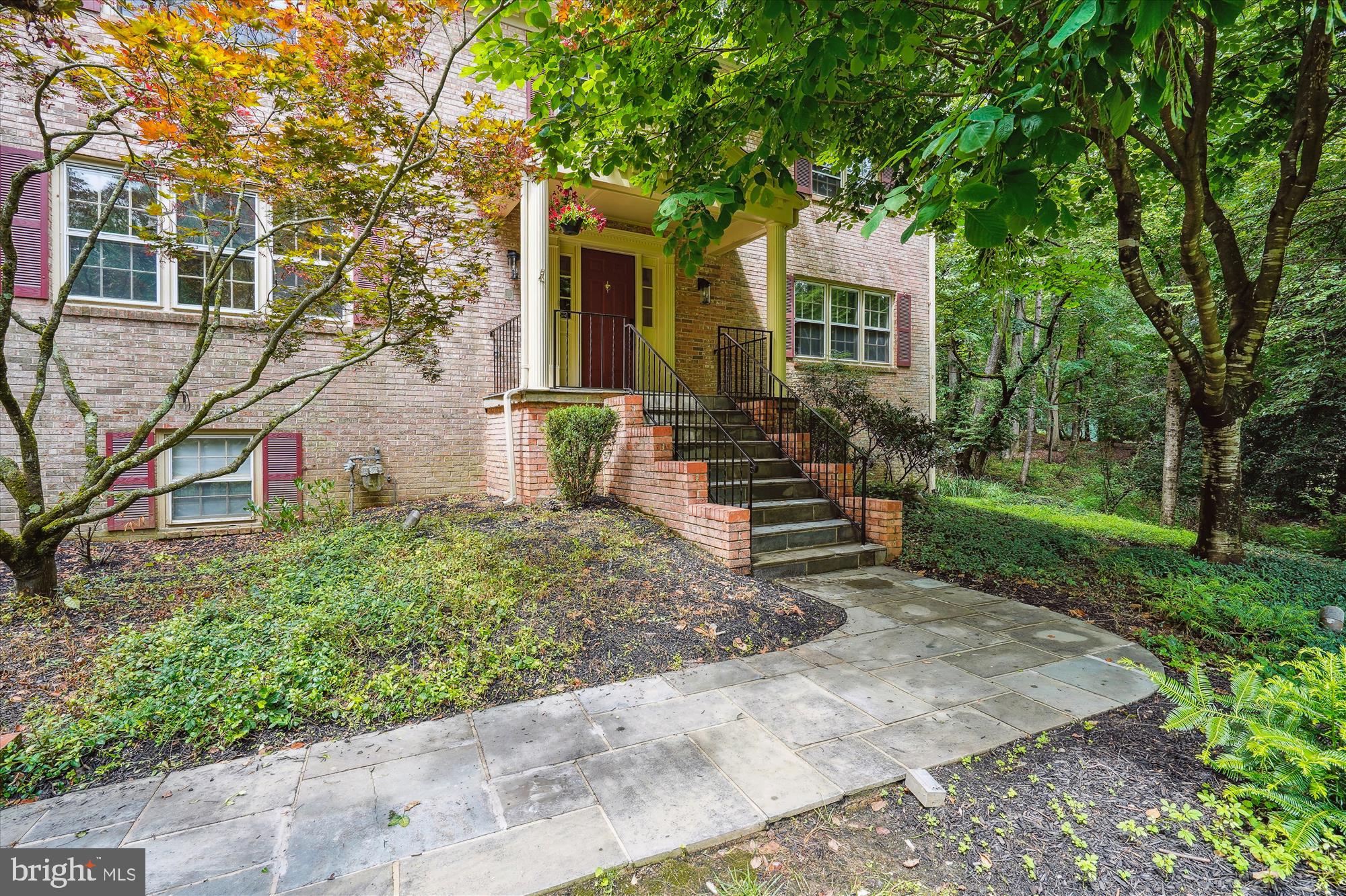 Welcome to your new beginning! This exceptional all-brick home in McLean, recently refreshed and move-in ready, offers the perfect blend of luxury, privacy, and convenience. Located in the prestigious Langley pyramid, you'll enjoy quick access to Tysons Corner, the Beltway, and the Silver Metro line; minutes to DC.  
Set back on a manicured .93-acre homesite, the home and backyard amenities are designed for exceptional privacy and a connection to nature. Imagine relaxing in your beautifully landscaped backyard, a true sanctuary featuring a screened porch, sun deck, patios, and a mesmerizing koi pond with waterfalls – perfect for everything from quiet mornings to lively entertaining.
Inside, you'll be greeted by a spacious foyer leading to thoughtfully designed living areas, including two large family/living rooms, a dining room, a bright breakfast nook, and an updated kitchen with plenty of space for family chefs. Upstairs, find a generously sized primary suite featuring a luxurious split master bathroom with extra-large tub, separate shower, dressing area and walk-in closet. Three additional well-proportioned bedrooms and another full bath ensure comfort for everyone. The lower level is perfect for an in-law or au pair suite, with a bedroom, full bath, and a cozy recreation room with a wood-burning fireplace. An oversized garage and workroom provide ample space for hobbies and storage.
With new flooring, refinished hardwood floors, and fresh paint completed in July 2025, and a new roof in 2024, this discerning home is ready to embrace its next family.