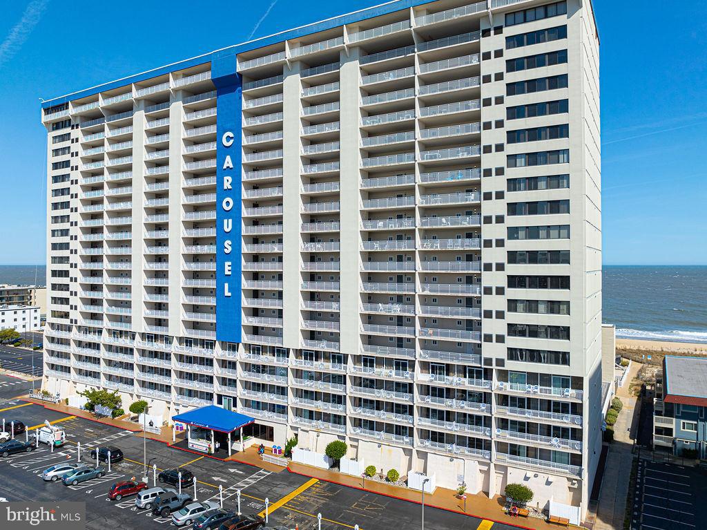Exceptional Investment opportunity.  Now priced at 949,000.00 after a 40,000.00 price reduction.  Enjoy immediate rental income with bookings in place through June, July, August and into September. 
Perched high on the 11th floor of the iconic Carousel Oceanfront Hotel and Condominiums, this beautifully positioned oceanfront residence offers the perfect blend of space, views, and resort-style living in the heart of Ocean City, Maryland.
This expansive 3 bedroom, 2 bath unit with an additional den provides exceptional flexibility for both personal enjoyment and investment potential.  The thoughtfully designed layout includes a bayside- facing den, allowing for peaceful sunset views, while the main living area opens to a private balcony  with sweeping oceanfront views-the perfect backdrop for morning coffee or evening relaxation.
Inside the residence is filled with natural light and coastal charm, with generous living and dining spaces ideal for entertaining.  the den offers additional room for guests, or a cozy retreat, making this unit live larger than expected.
Residents and guests enjoy access to an impressive array of amenities rarely found in one location.  The building features an indoor ice-skating rink-an Ocean City landmark-along with game rooms, a heated indoor pool for year-round enjoyment, and a refreshing outdoor pool just steps from the beach.
Whether you are looking for a serene seaside escape, a family-friendly vacation home, or a strong rental opportunity, this 11th floor oceanfront gem delivers on every level with its prime location, versatile layout, and unmatched amenities.