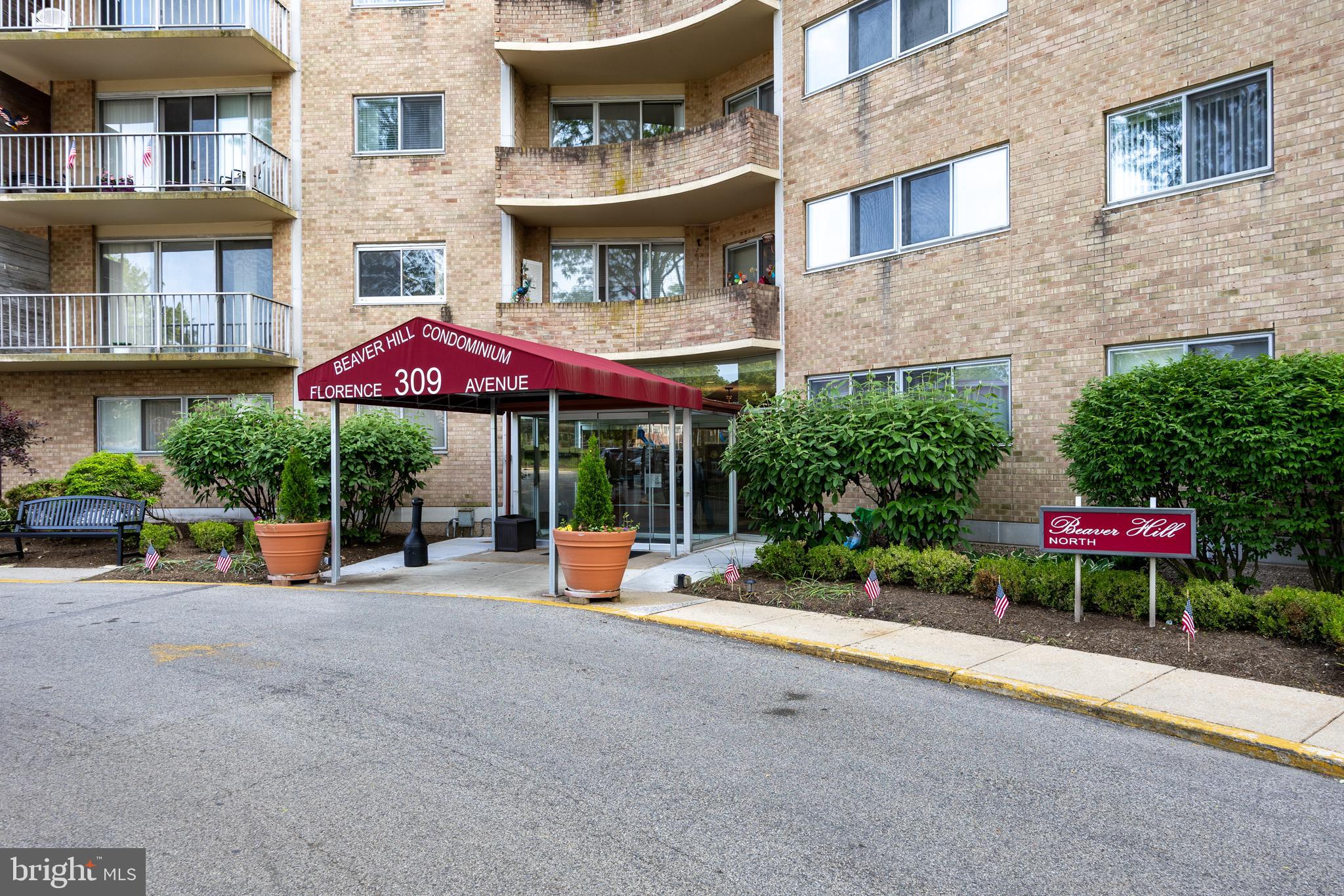 Welcome to easy living in this spacious 1,100 sq. ft., 1-bedroom, 1-bath condo at Beaver Hill North in desirable Jenkintown. This move-in ready home features classic parquet flooring, an updated bath, and a convenient kitchen with a brand new dishwasher just installed. The large living room opens to a private balcony with abundant natural light and peaceful views of the pool and green space. Offering more square footage than many 2-bedroom units, this condo provides exceptional living space. The condo fee includes all utilities—heat, A/C, electric, gas, water—plus doorman service, van transportation, common area maintenance, snow and trash removal. Residents can enjoy the community room, with optional access to the pool and fitness center for a small fee. Guest rooms and a private event room are available to rent, and additional storage is located in the building’s lower level. Just steps from the train, shopping, and dining. No pets permitted.