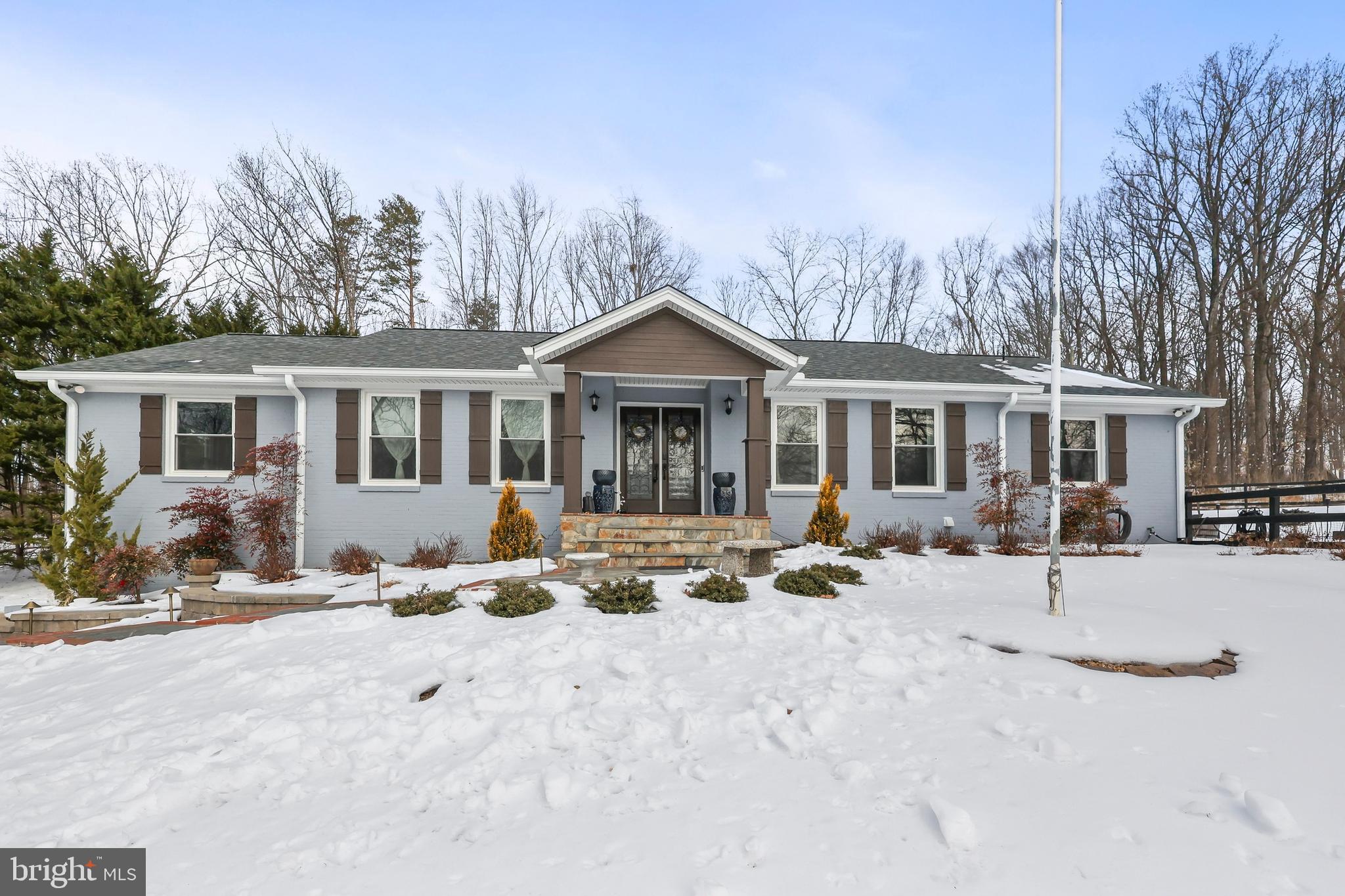 This one is a must-see! Ideally located in the heart of Warrenton on a beautiful, spacious 1.6-acre lot, this home showcases over $245,000 in renovations completed since 2020—offering the perfect blend of location, a peaceful and serene setting, and modern living. Nestled on a quiet street, this modern home welcomes you with recent renovations/upgrades including brand new siding (2021), new AC system (2021), new roof (approximately 2018), $45,000 in landscaping and a new patio (2021), fully updated bathrooms (2025), a brand new basement with a bedroom/office space, remodeled sunroom with new tile (2021), and many, many more. The basement was completely redone in 2021, and proudly features a rec room, living area, custom cabinets, a built-in shoe rack, and last but not least, for the animal lovers, a pet washing station! Enjoy seamless access to the deck out to your property and the newly installed patio, creating an ideal indoor-outdoor flow for relaxing or entertaining. A stylish new beverage bar adds the perfect finishing touch on this gorgeous home, while Elfa modular shelving in every closet provides customizable, adjustable organization to suit any lifestyle. See MLS documents for a detailed list of renovations and costs—this beautifully upgraded home truly stands out. Schedule a showing today, this home is a must see!