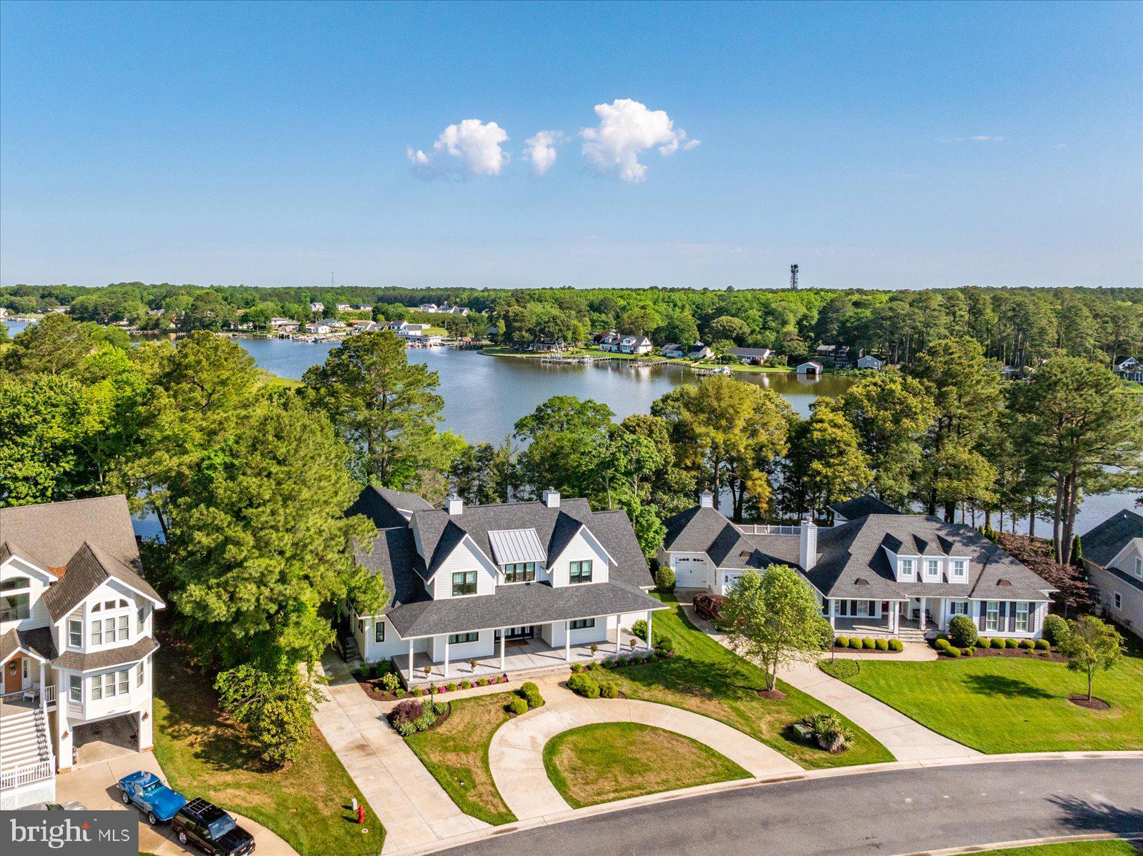 *Coming Soon* This waterfront Modern Farmhouse built in 2021 features a private inground heated pool.  Arrive in style parking in the half circle driveway leading to the huge wrap around concrete front porch.  Enter through the double doors and you will immediately take in the water views.  A grand foyer leads to the great room featuring a fabulous kitchen with an abundance of cabinet storage and a large island adorned with quartz countertops.  There is a large dining area that leads to a private office for those working from home.  The family room has built-in's surrounding the gas fireplace.  Beyond the family room is a formal living room that could also be used as a 7th sleeping area if needed.  The first floor also features a primary bedroom with two large walk-in closets with custom organizers.  The primary bath has a roll-in shower and dual vanities.  The primary bedroom overlooks the pool and creek providing a calming retreat.  The first floor of the home also includes a large laundry room and half bathroom.  The laundry room leads to the oversized 3 car garage that includes a slider to the pool deck.  The pool is heated and quite deep, a feature not often found in this area.  The pool deck has its own private bathroom a feature you will appreciate as the water all stays outside while entertaining.  The second floor can be accessed via the stairs, but the current owner thought ahead and designed the home so that an elevator could be installed in the future servicing both floors of the home and the garage.  Upstairs your guests will have plenty of room to spread out between the loft space view peaks of the gold course across the street and now 5 additional bedrooms and 3 additional bathrooms.  The bonus room is used as a bedroom and currently has a closet, however, if an elevator were to be installed the closet would be absorbed by that.  The bonus room now features a full bathroom and could be used as an additional owner's suite.  It has a balcony overlooking the pool and creek.  To service all bathrooms this home has two tankless gas water heaters.  To ensure comfort and efficiency the home is heated and cooled with two dual fuel heat pumps with gas backups.  Another feature you will love is the abundance of parking for guests in the half circle concrete driveway and additional concrete driveway leading to the 3-car garage.  The lawn is irrigated and maintained by the HOA.  The gated Glen Riddle community is highly sought after and features an abundance of amenities including a clubhouse with fitness center, locker rooms with saunas, card room, game room with billiards and table tennis, meeting room with kitchen, on-site professional management offices, outdoor pool with integrated hot tub, kid's water pad, tennis court, and pickleball courts.  Also note that Glen Riddle has two popular golf courses and a driving range with memberships available.   The community allows for residents to register their personal golf carts and they can be used on the community roads.  Glen Riddle is a resort style community offering so much to its residents and that combined with the location just a few miles from the pristine beaches of Ocean City, MD makes this a property you will want to tour.