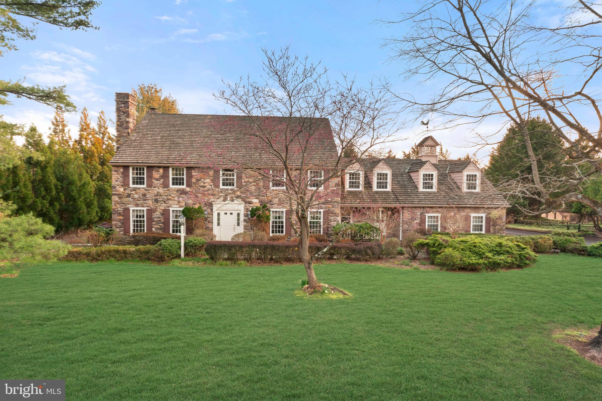 Tucked away in the prestigious and private enclave of Cedar Glen in New Hope, this exceptional estate offers a rare opportunity to own a home in a community of just fourteen residences. Set on a little over an acre and surrounded by natural beauty, this property combines timeless character, generous space, and incredible potential in one of Bucks County’s most desirable locations.

Boasting six bedrooms and five full bathrooms, this expansive home is designed for both everyday living and grand entertaining. A three car garage and impressive curb appeal set the tone, while a cedar roof and a new steel roof over the sun porch add to the home’s durability and charm. Inside, the foyer and family room welcome you with rich hardwood flooring, leading into a warm and inviting family room complete with a wood burning fireplace. The living room also features its own wood burning fireplace, creating multiple cozy gathering spaces throughout.

At the heart of the home, the kitchen is equipped with premium Wolf appliances, beautiful wood cabinetry, and granite countertops, offering both function and style for any home chef. Just beyond, a stunning sunroom provides the perfect space to relax and enjoy views of the property year round.

The fully finished walkout basement expands the living space even further, featuring its own kitchen and a full bathroom, ideal for guests, entertaining, or multi generational living. Additional features include central vacuum, a water softener, and three zone HVAC for optimal comfort.

Upstairs, the second floor offers six spacious bedrooms and three full bathrooms. The primary suite is a true retreat, complete with two walk in closets, a double sink vanity, soaking tub, and separate stall shower.

Step outside to your private backyard oasis, where a Trex deck installed just last year overlooks the beautifully maintained grounds. Enjoy summer days by the chlorine pool and unwind in the hot tub, all enhanced by a three zone sprinkler system that keeps the lush landscaping vibrant.

With its expansive layout, thoughtful features, and unbeatable location, this home presents unbelievable potential to create your dream estate in one of New Hope’s most sought after neighborhoods.