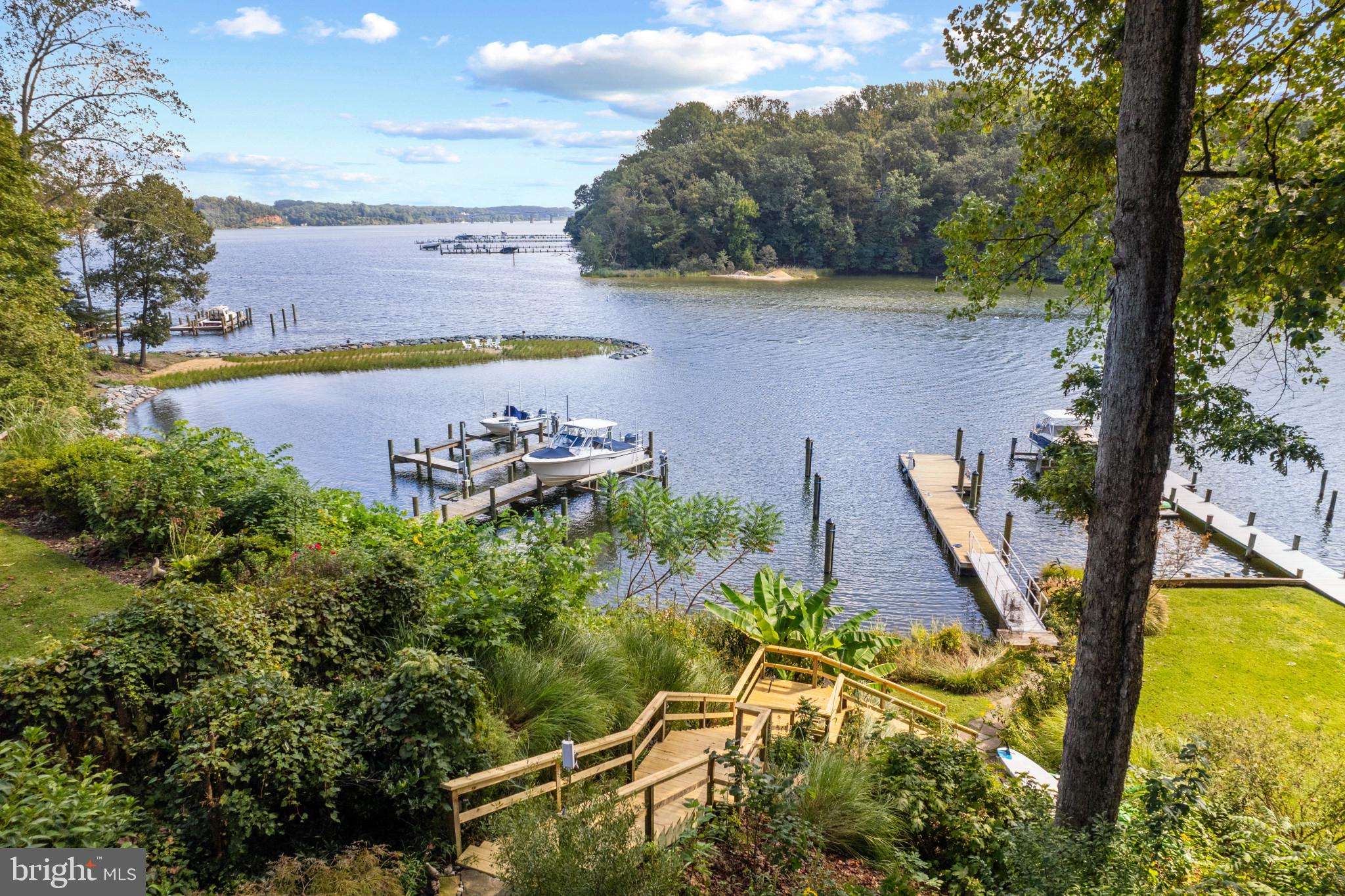 Epping Forest WATERFRONT!  Stunning Craftsmen cottage in Epping Forest with captivating water views across Saltworks Creek to the Severn River.  Recently updated with new roof, remodeled bathrooms, redesigned upper level with new spacious balcony, new stairs to the new floating dock and much more has been improved on this fabulous property. This highly coveted private gated waterfront community on the Severn River offers the perfect setting to celebrate the Annapolitan lifestyle and the charming 3 bedroom, 2.5 bath home provides all the necessary elements for easy waterfront living.   As you walk into the home the tall ceilings and natural light from the walls of windows and doors frame the beautiful setting and highlight the lush landscaping and water views.  The stunning wood floors, updated finishes and thoughtful layout create a comfortable and striking interior space.  The open floor plan is perfect for entertaining with the Gourmet Kitchen, Dining Area and Living Room with fireplace all seamlessly flowing out to the waterside covered porch; the perfect place to dine al fresco or head a few steps closer to the water to the seating area and roast some marshmallows over a fire pit as you watch the activity of the boats and waterfowl on the Severn River.  The upper level boasts 2 bedrooms with shared bath and spacious private balcony off the Primary's bedroom offering breathtaking elevated views and cool summer breezes.  The lower level contains a family room, bedroom and full bath for all those extra guests you are sure to have!  The recently built deep water floating dock with 50ft boat slip is a boating enthusiast's dream and the dedicated mooring ball that conveys with the property adds additional options for docking. The location provides easy access to explore all of Annapolis's waterways and beyond.  Exclusive Epping Forest Gated Community offers fabulous amenities including the clubhouse with waterside bar and grill, deep-water marina, sandy beach, boat ramp, tennis courts, hiking paths plus year-round activities including: July 4th fireworks, Labor and Memorial Day festivities, oyster roast and summer camps. There's so much fun to be had in Epping Forest, great social clubs include the boat club, volleyball leagues, swim team and garden club. Come and enjoy all that Epping has to offer! Conveniently located to access Downtown Annapolis, head over the Bay Bridge to the Eastern shore or jump on Rt. 50 to get back to Washington, D.C. Annapolis living at its best! Epping Forest is a Special Tax District, ($2456.14/yr.) with binding Rules & Regulations.  Welcome Home!