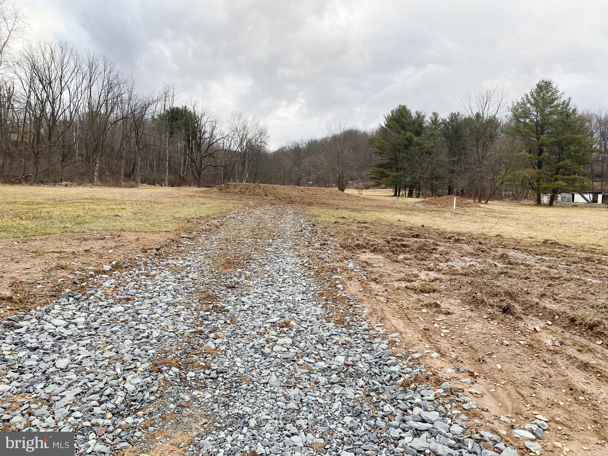 Build your Dream Home, Business or Home Occupation.  This beautiful 8 Acre Country lot has a small Pond and Stream.  There are so many possibilities what you can do with this land.  Bring your imagination and turn this lovely acreage into a Country retreat, Gentleman's farm for your Horses, Ranch style home for Mom and Dad and Log Cabin for yourself......  There is an artesian well and Owner just installed a Brand New Septic system.  There are two driveways and a private treelined stone driveway where there was a foundation for a home and barn.  Side of property has 1,405 sf of frontage on RT 309.  Country setting but borders Rt 309  Zoned HC with residential use.  ? please check West Penn Township website  for specific requirements.