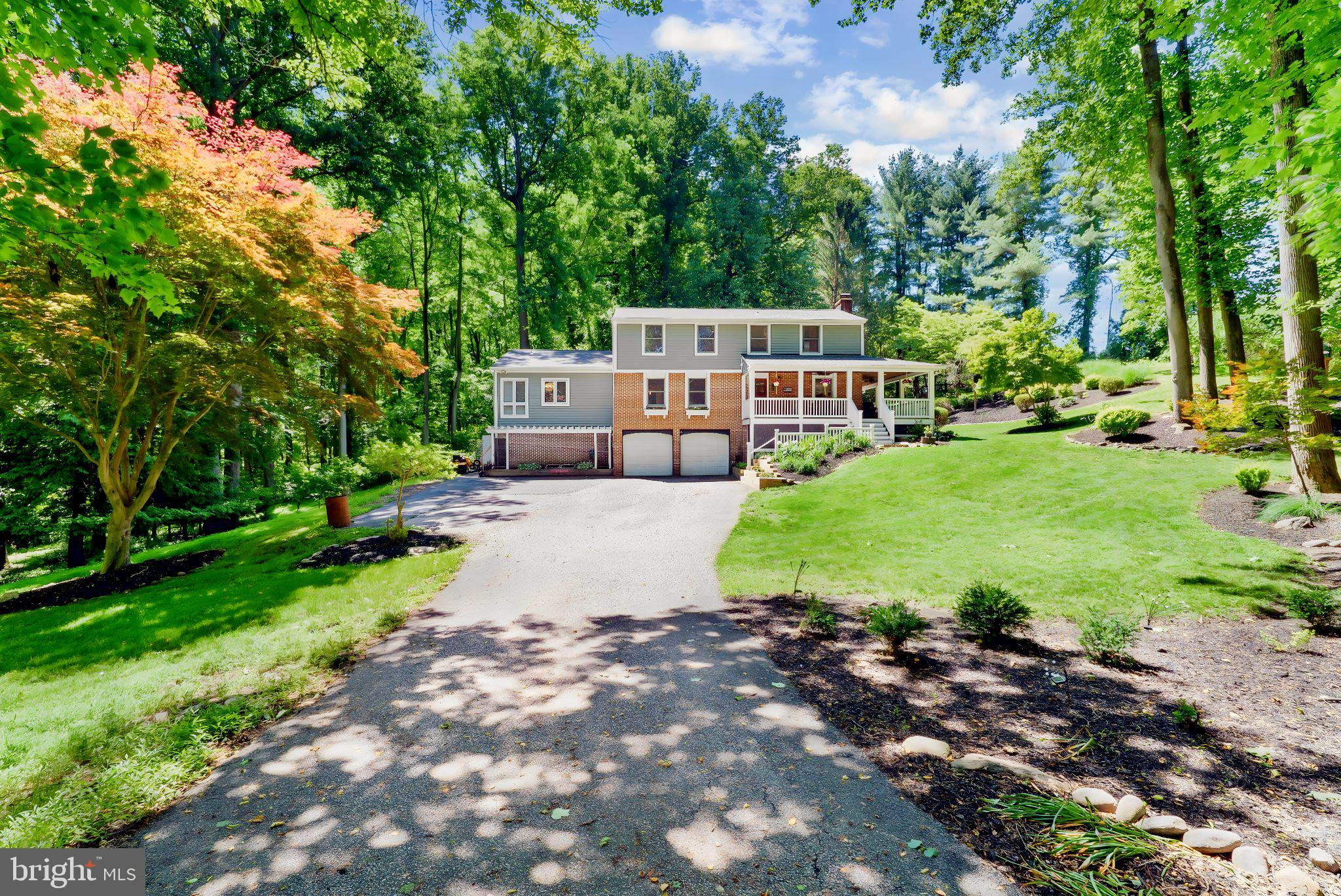 Welcome to 9 Folly Farms Court, nestled in the  Folly Farms neighborhood of Reisterstown. Situated on a private 2-acre lot, this stunning 5-bedroom, 3 full and 1 half bath Colonial offers the perfect blend of timeless charm, thoughtful updates, and peaceful surroundings.

You are welcomed home by a beautiful wraparound covered porch, with scenic views setting the tone for the warmth and character found throughout. The main level features hardwood flooring and an impressive main-level primary suite addition, offering the ease of main-level living. This private retreat showcases a spacious bedroom with walls of windows overlooking the picturesque backyard,  it's own private deck, a large walk-in closet, and a beautifully renovated spa-like bath featuring a modern soaking tub, stunning tiled shower with built-in niches, heated floors, and serene finishes that create a true sense of relaxation.

At the heart of the home is the expanded, recently renovated  2 year old kitchen—a true chef’s dream. Bright and open, this space features beautiful quartz countertops, newer appliances, beautiful flooring, and scenic backyard views. Perfect for entertaining, the kitchen flows seamlessly into the spacious family room, complete with a brick wood-burning fireplace, charming stained-glass accent window, built-in bench seating, and sliders leading to the deck overlooking the peaceful, private setting.

Just off the kitchen, the extra-large dining room offers the perfect gathering space for holidays, celebrations, and everyday meals. A conveniently located half bath completes the main level.

Upstairs, you’ll find brand-new carpeting throughout, including a second primary suite with its own full bath and walk-in closet. Three additional generously sized bedrooms all offer beautiful views of the mature landscaping and private grounds, along with a beautifully updated hall bath.

The finished lower level offers a spacious recreation room with built-ins, laundry area, storage, and access to the oversized two-car garage, currently used as a workshop. Beneath the primary suite addition, an expansive storage area provides plenty of room for tools, equipment, seasonal items, and more.

Additional highlights include arched doorways, casement windows, recessed lighting, electric fence, and a  new dedicated HVAC system and hot water heater for the primary suite addition. Cub Cadet riding mower is included.

If you are searching for a home that offers privacy, two primary suites, main-level living, a stunning updated kitchen and beautiful updates throughout, all while showcasing true pride of ownership, this exceptional property is not to be missed. Truly a rare offering in an incredible location!
