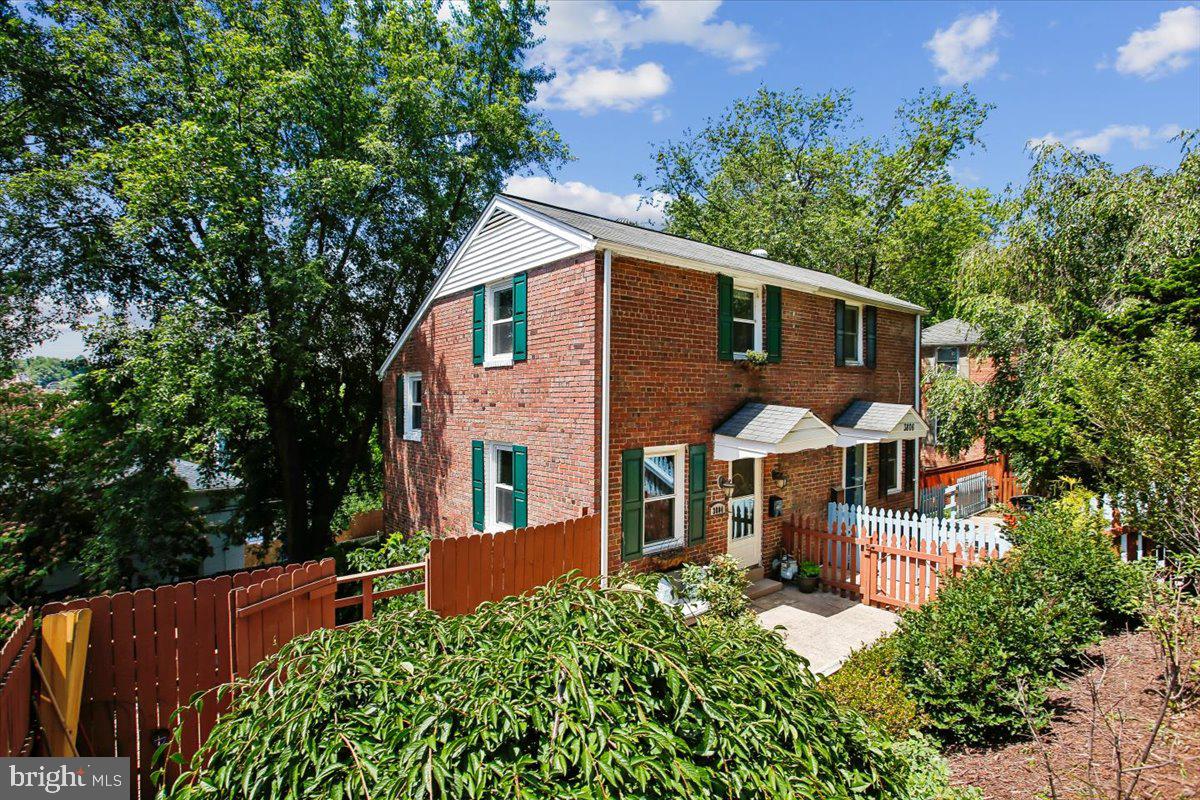 Tucked into Arlington's Fort Barnard Heights neighborhood, this three-bedroom, two-bath home offers more than 1,200 square feet of comfortable living space, just moments from Shirlington Village, where a variety of popular restaurants, cafes, and local favorites are within walking distance, as well as Old Town Alexandria and some of the area's best commuter connections.

A versatile floor plan places bedrooms on separate levels, offering privacy and flexibility for guests, roommates, a home office, or multi-generational living.

The home's standout feature is its expansive, tiered outdoor space, with multiple levels of decking that create a rare opportunity for outdoor entertaining, gardening, play space, or simply enjoying a quiet evening outdoors.

Recent improvements include new landscaping and a front bulkhead renovation completed in 2023, along with a new dryer. The updated kitchen features granite countertops and black stainless steel appliances, while abundant storage throughout the home provides space for everyday living and organization.  ROOF 2010.  WINDOWS 2016.  Washer & Dryer convey as-is.

Residents enjoy easy access to parks, trails, dining, shopping, and major commuter routes, while still enjoying the charm and character of an established neighborhood.

Just minutes from Fort Barnard Park, the W&OD Trail, Four Mile Run Trail, Shirlington Village, National Landing, and Washington, D.C., this location offers the perfect balance of convenience, outdoor recreation, and community.

With no HOA, convenient street parking, timeless character, and exceptional outdoor space, this home presents a rare opportunity to enjoy a well-connected Arlington location with easy access to everything the area has to offer.