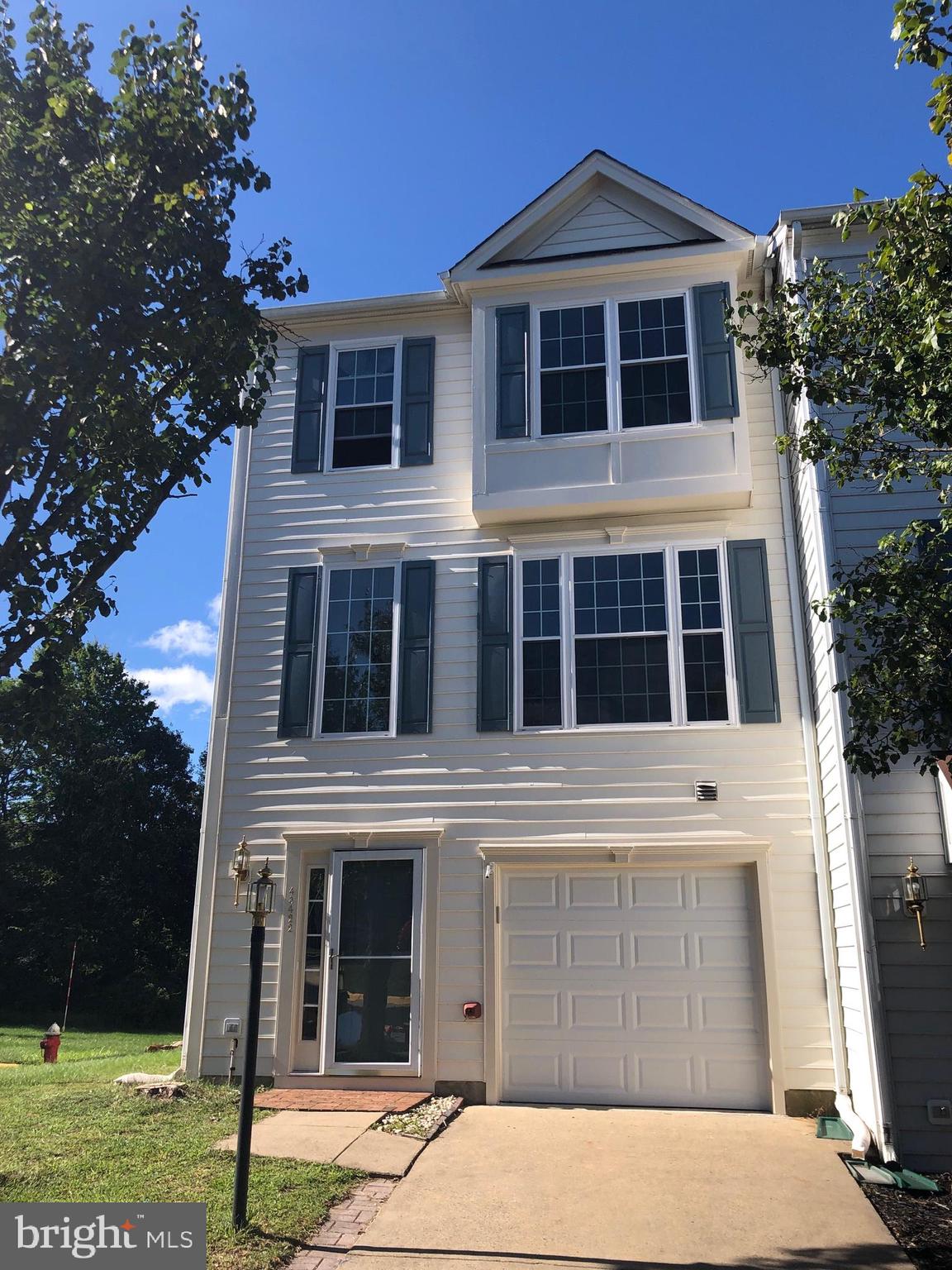 Spacious end unit Townhouse. 3Bedrooms, 3FullBath, 1HalfBath, 1 car garage with extra parking spaces.   approx 2100 sq ft finished End unit Town Home with 3 level Extension in Premium lot, back to trees. Hardwood floors on Main level, Deck & Patio, new vinyl plank, new washer & dryer, newer HVAC, newer Windows . 1.5 miles to Future Loudoun Metro Station and Rt.267,